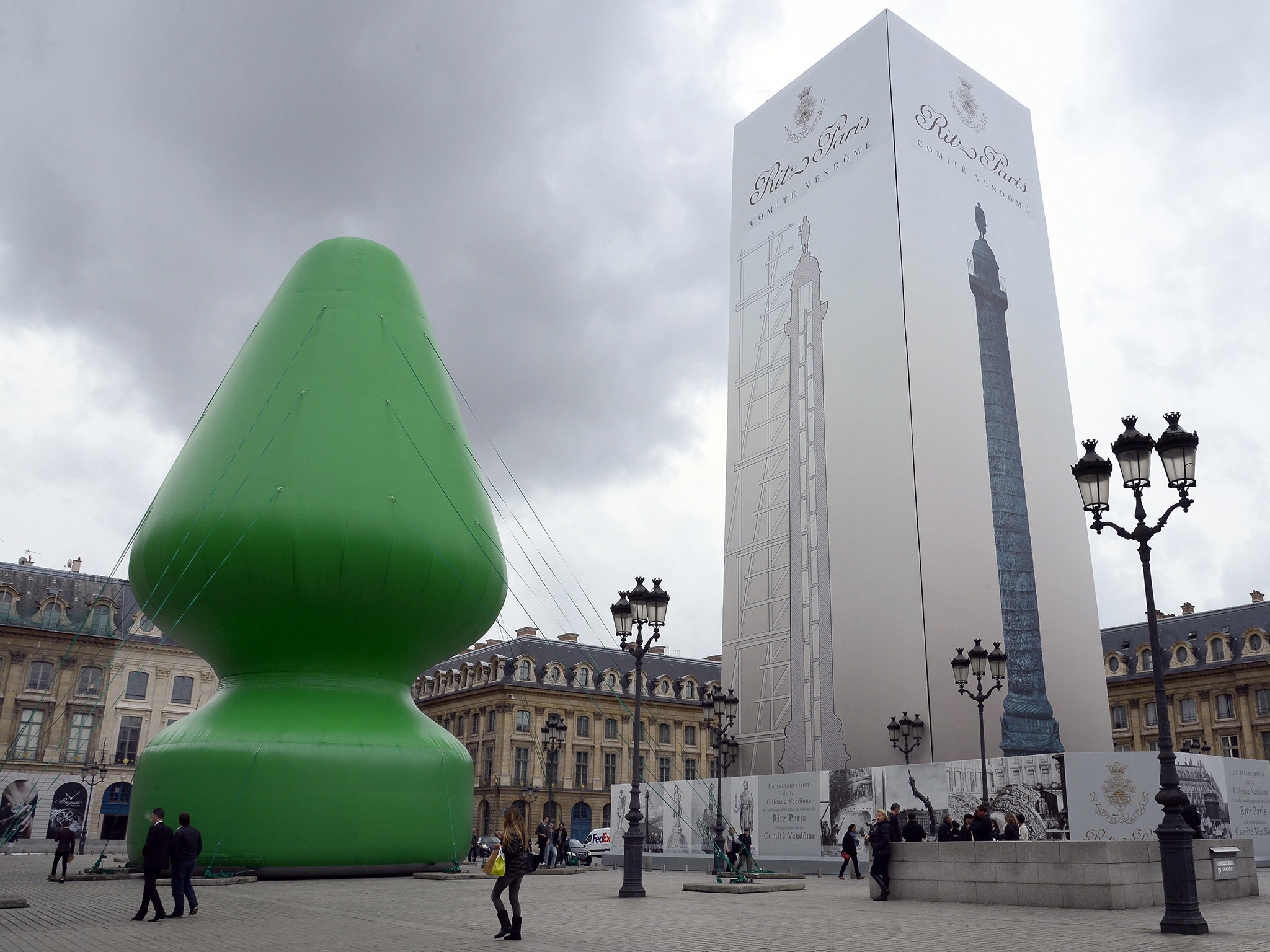 Paul McCarthy's inflatable sculpture of a Christmas tree is displayed on the Place Vendome in Paris