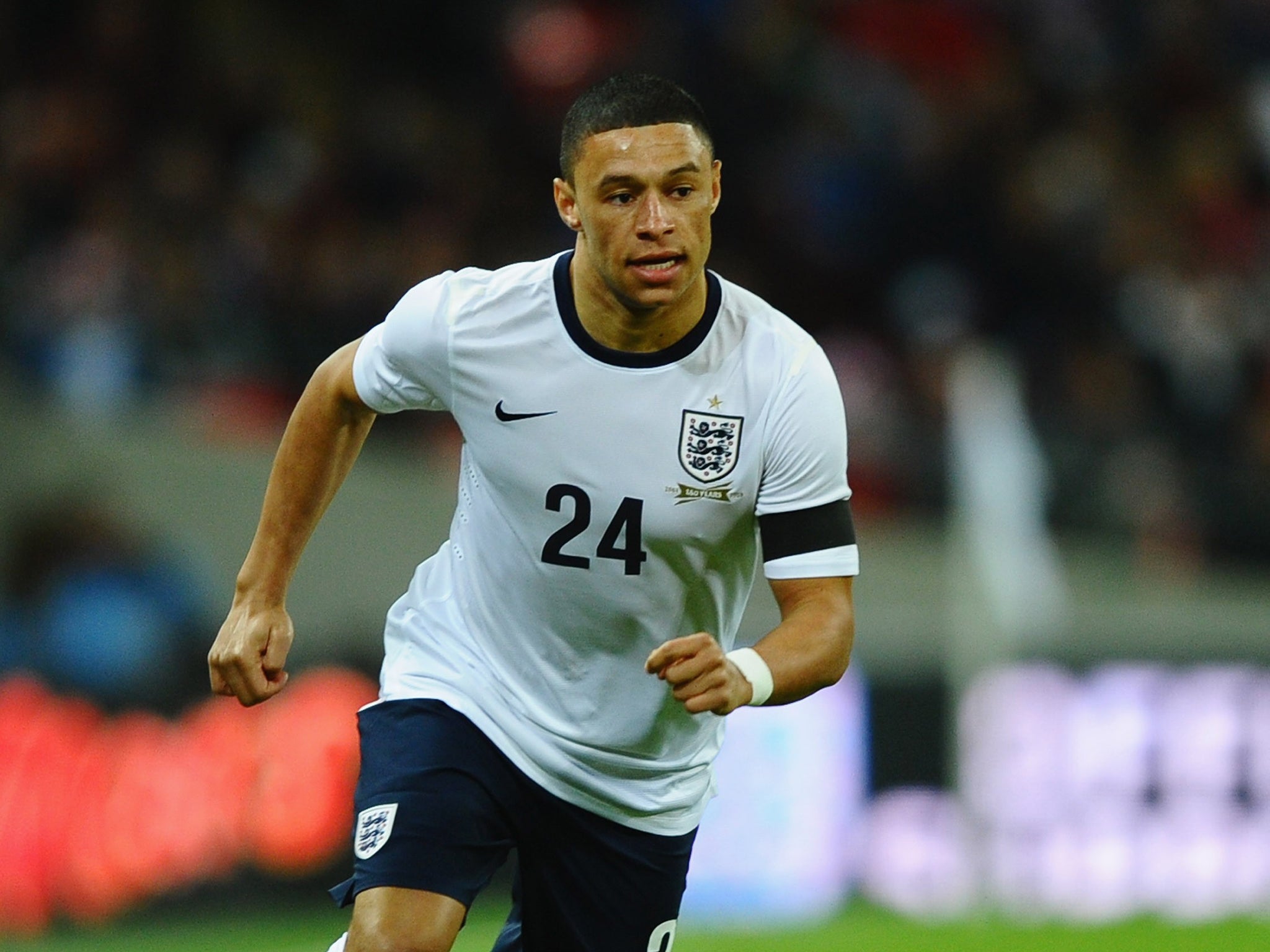 Arsenal midfielder Alex Oxlade-Chamberlain says he is willing to play for England Under-21s if called up next summer