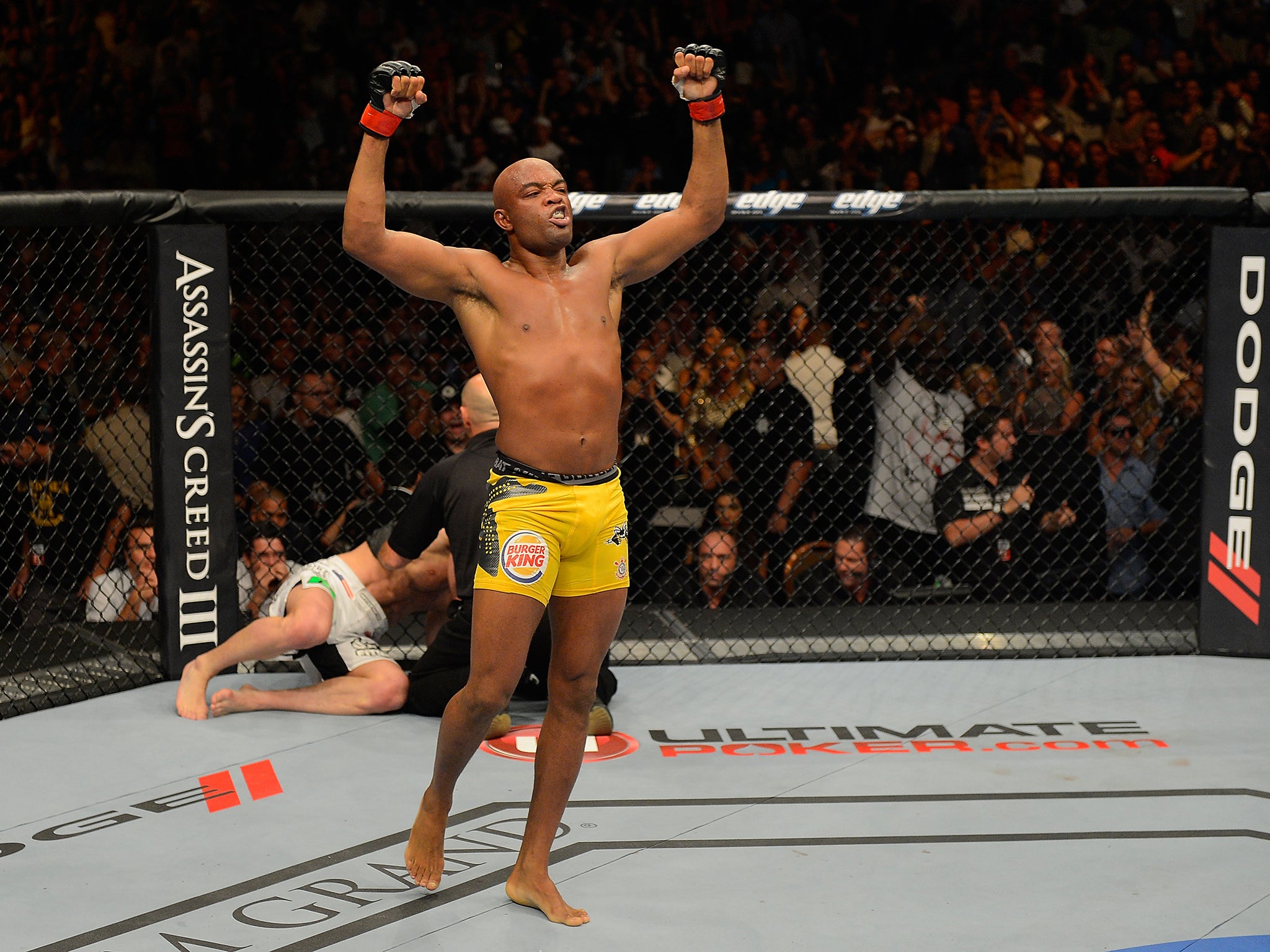 Silva reacts after knocking out Chael Sonnen during their UFC middleweight championship bout