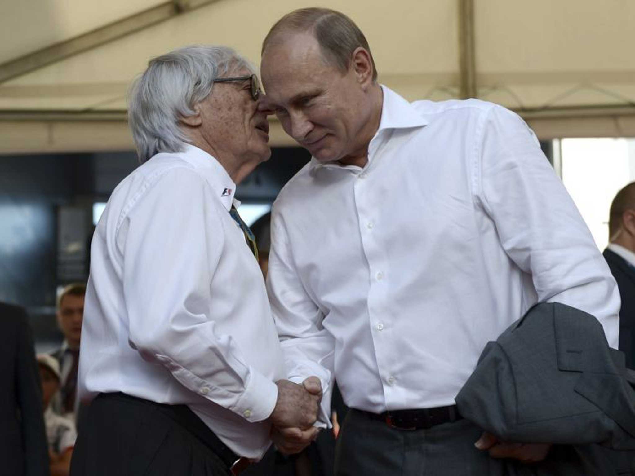 Bernie Ecclestone and Vladimir Putin greet at the Grand Prix