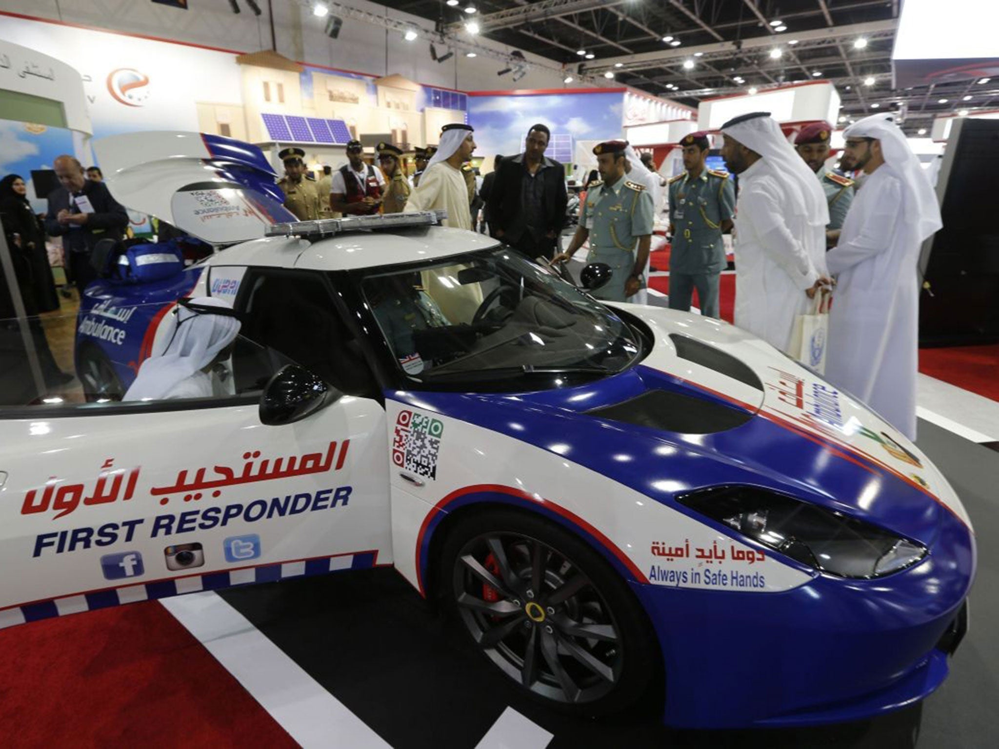 Visitors look at a first responder Lotus car at the Gitex Technology week in Dubai on October 15