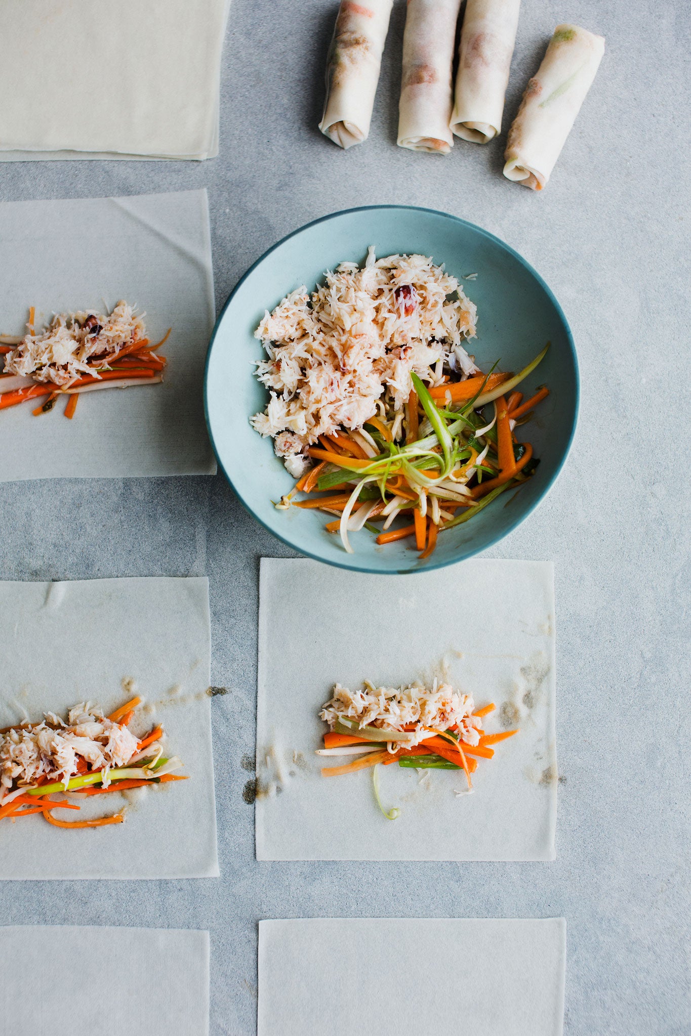 The ingredients laid out on the spring-roll wrappers