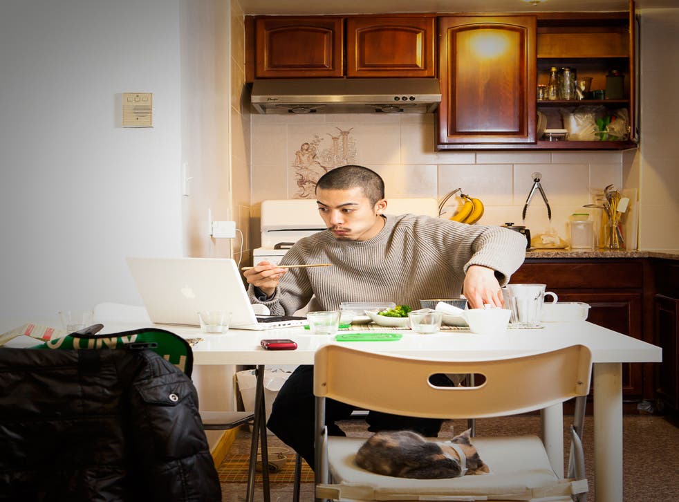 At 1.20am, after an intensive practice session, drummer Garro Heedae eats at his kitchen table in Vinegar Hill, Brooklyn, New York, with a computer screen and cat for company
