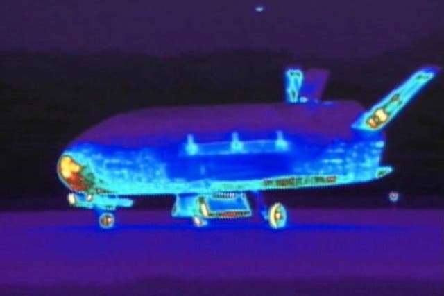 This June 16, 2012 file image from video made available by the Vandenberg Air Force Base shows an infrared view of the X-37B unmanned spacecraft landing at Vandenberg Air Force Base.