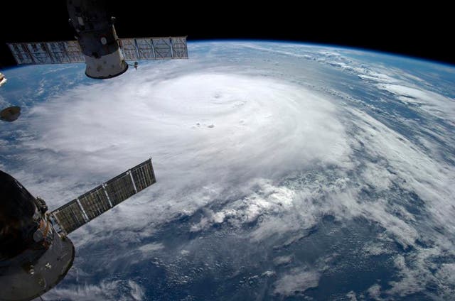 Hurricane Gonzalo is seen over the Atlantic Ocean in this NASA image taken by astronaut Alexander Gerst from the International Space Station yesterday - it will downgrade before heading to the UK