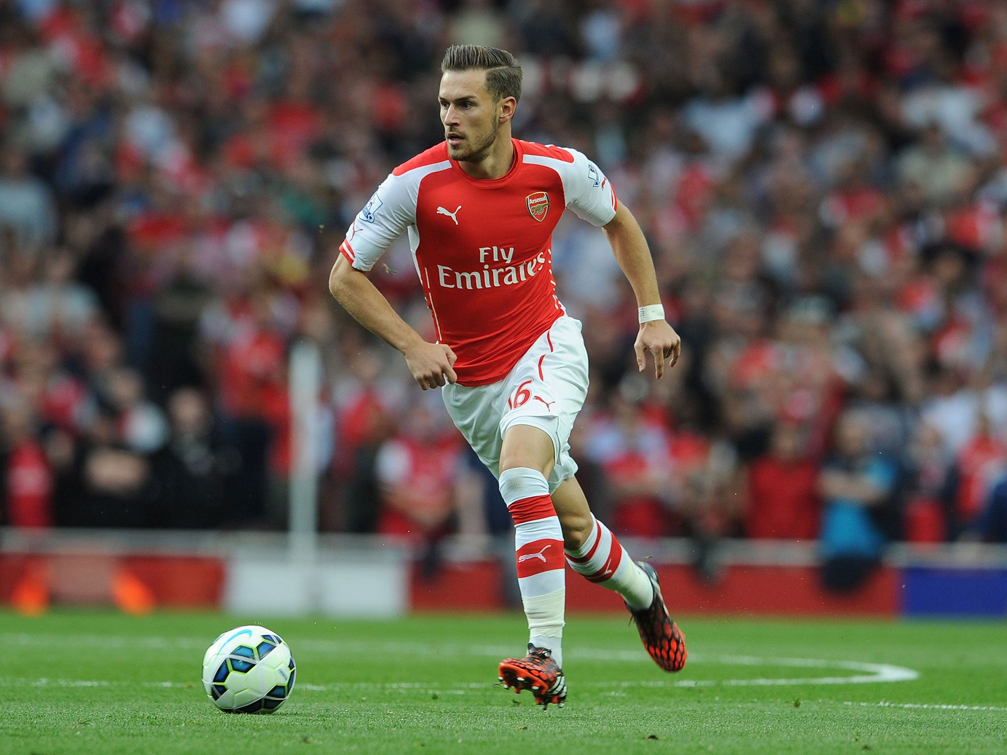 Aaron Ramsey runs with the ball during Arsenal's 2-2 draw with Hull on Saturday