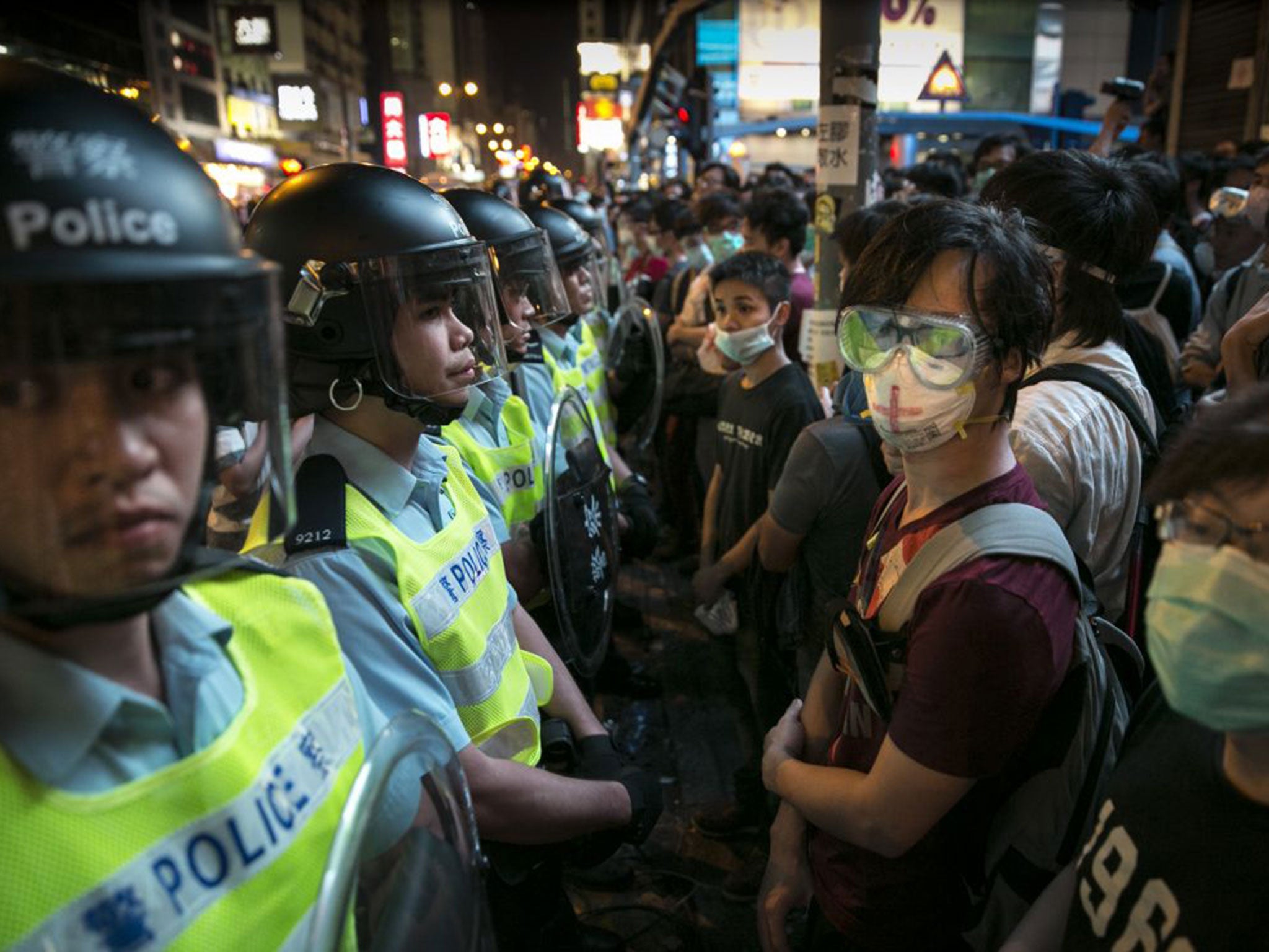 Hong Kong police confront protesters as they try to reclaim the core protest zone in Mong Kok on Friday night