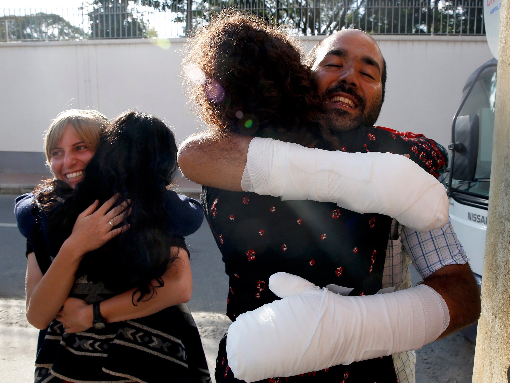 Israeli avalanche victims embrace before travelling home from Nepal