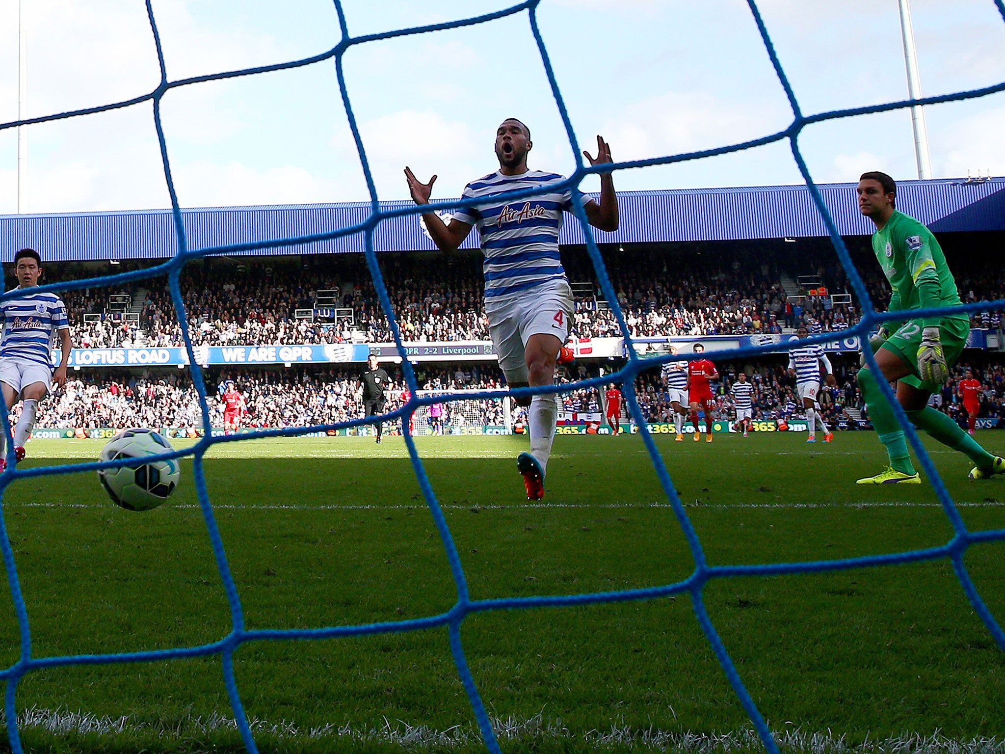 Steven Caulker of QPR scores an own goal during the Barclays Premier League match between Queens Park Rangers and Liverpool