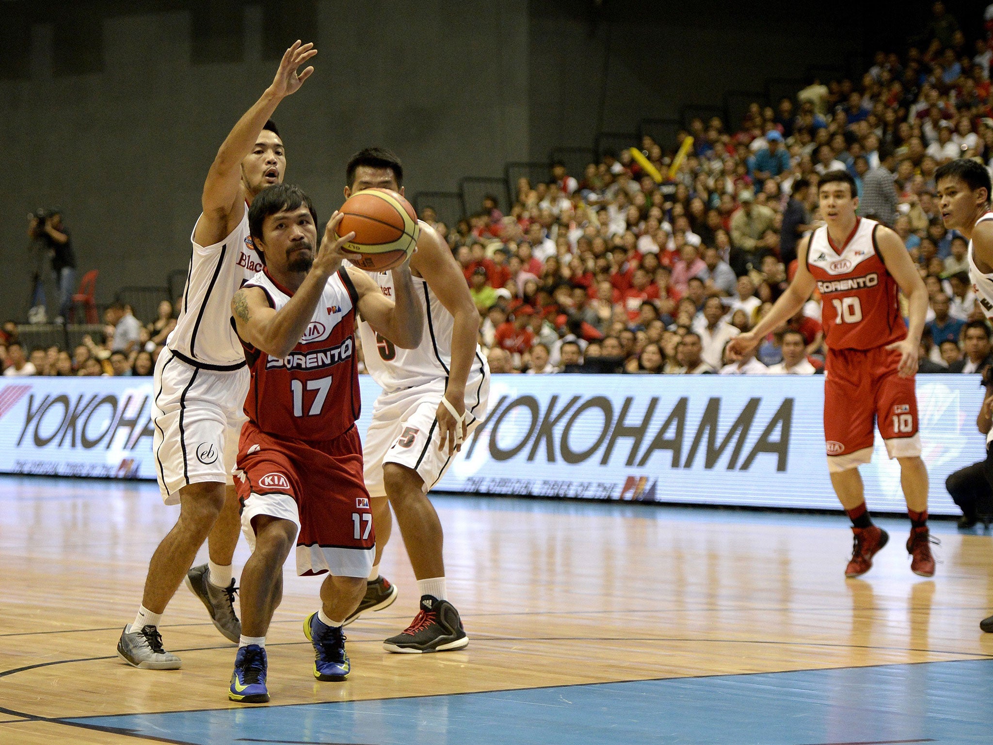 Manny Pacquiao (left) makes a pass