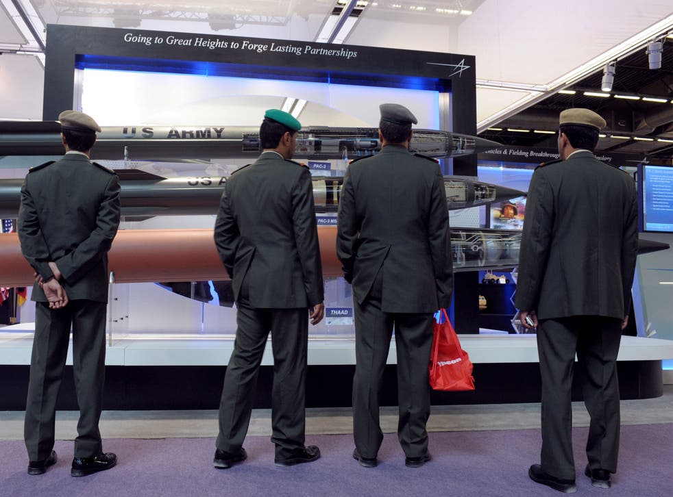 Officer visitors look at missiles in front of the Lockheed Martin stand at the Eurosatory 2012 defence and security exhibition in Villepinte near Paris on June 11, 2012