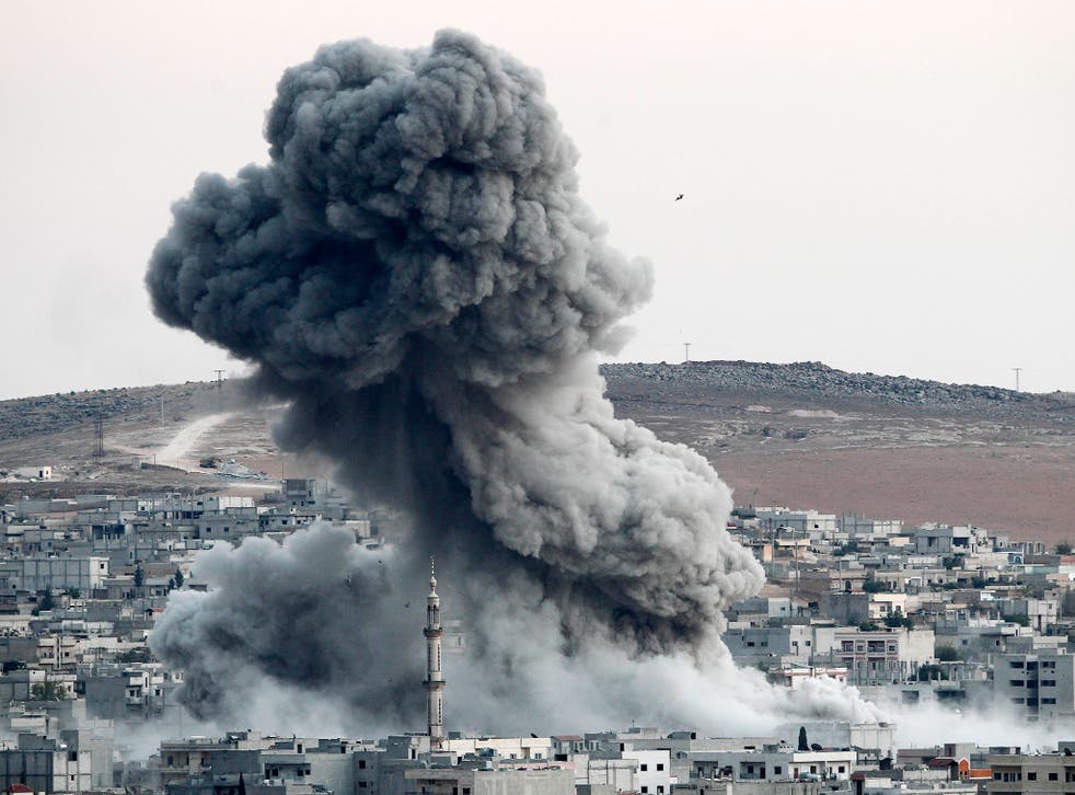 Heavy smoke rises following an air strike by the US-led coalition in Kobani