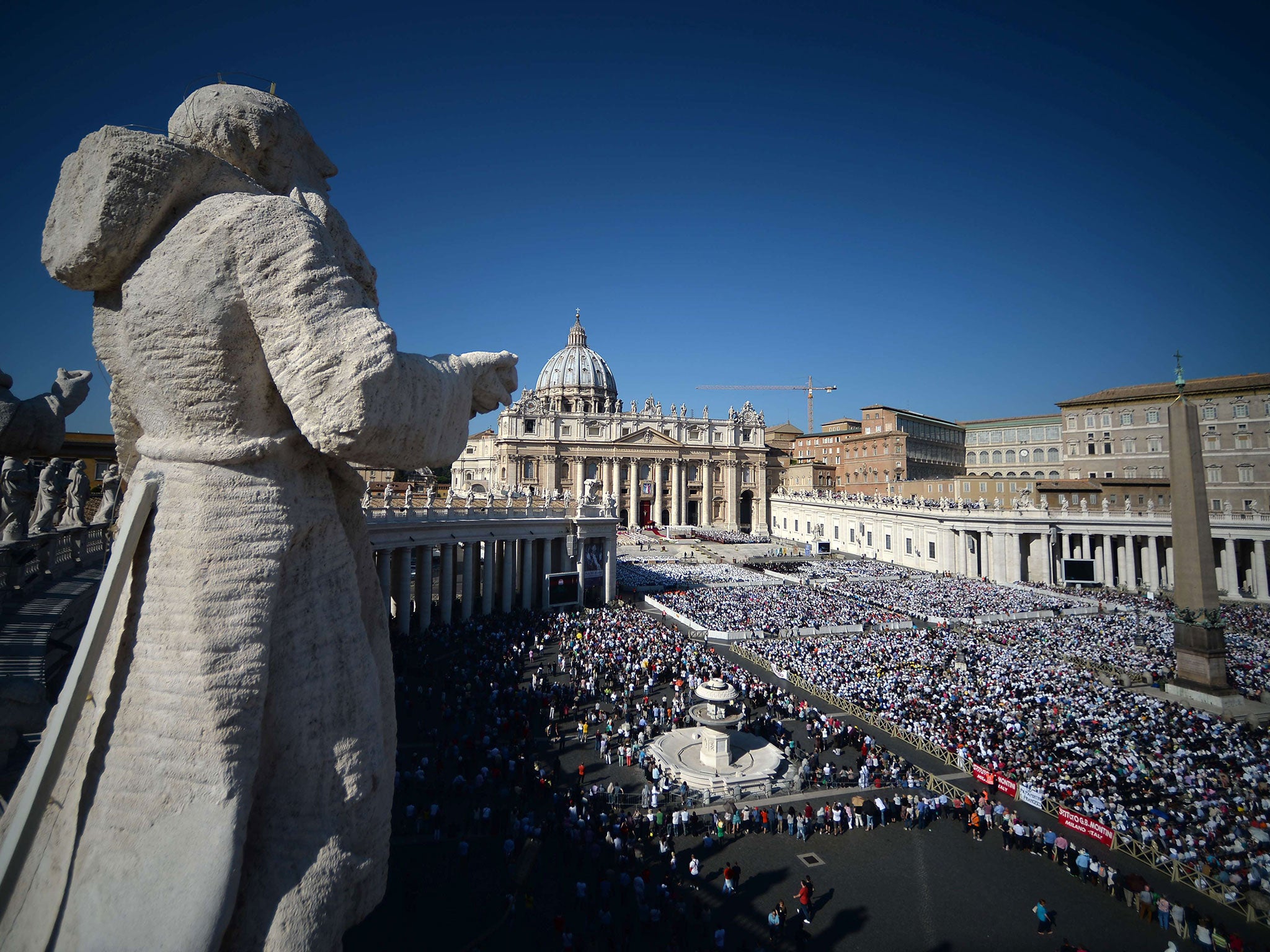 The faithful gather at a papal Mass for the beatification ceremony of Pope Paul VI at the Vatican
