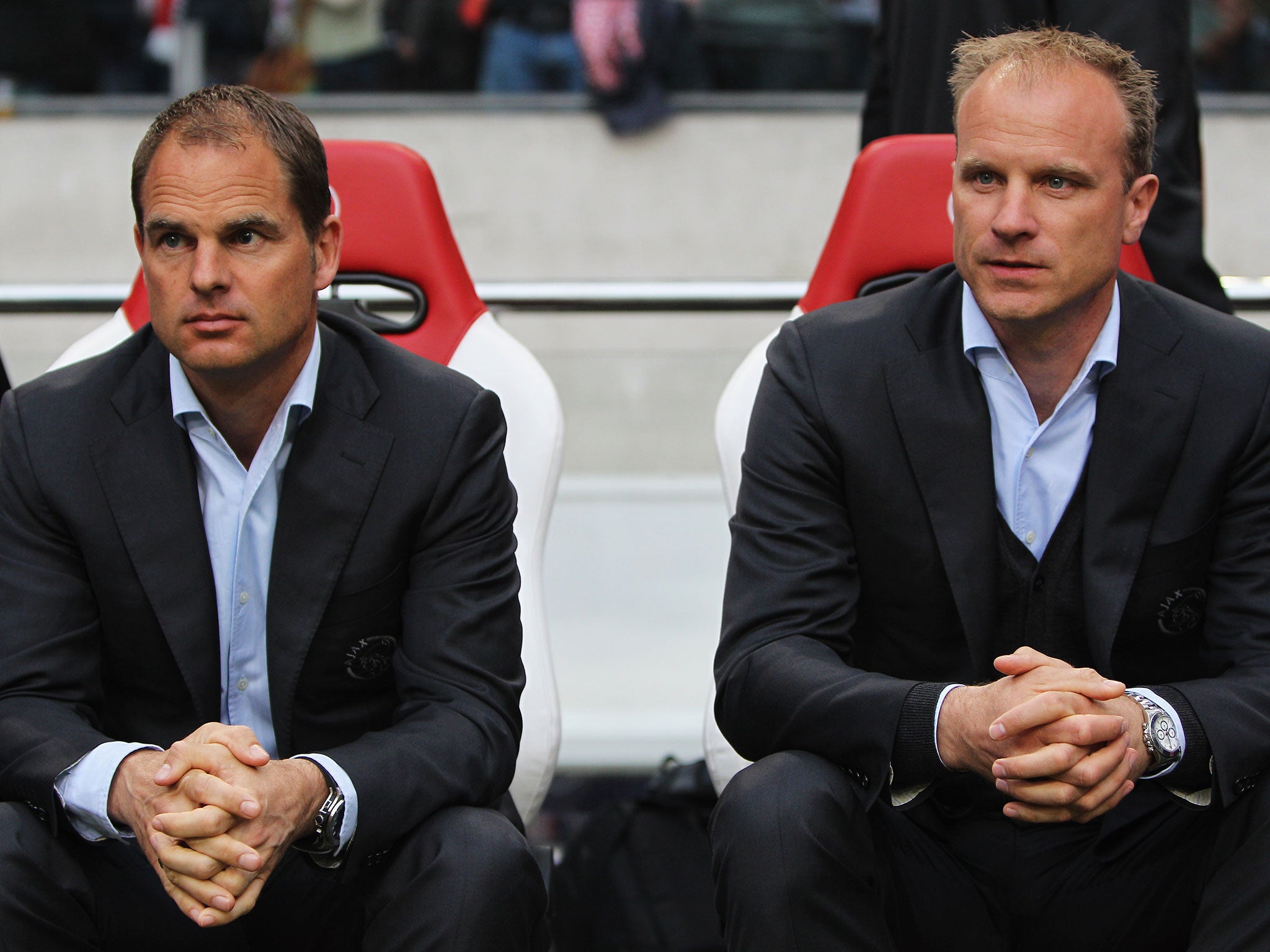 Dennis Bergkamp, right, has been linked with Championship outfit Reading