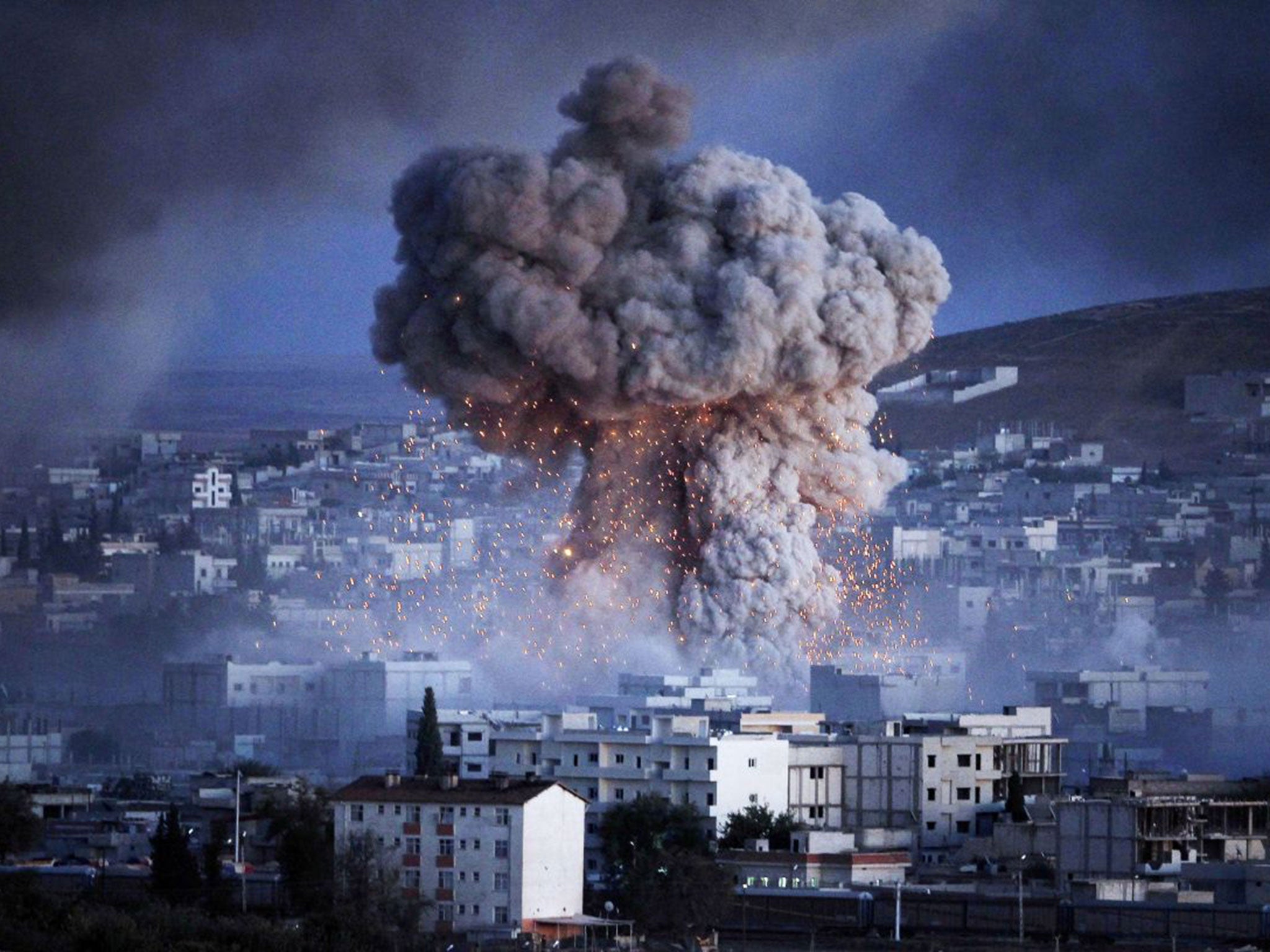 An explosion rocks the Syrian city of Kobani during a reported suicide car bomb attack by Isis on Monday (Getty)