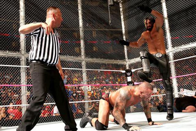 Seth Rollins delivers a curb-stomp to his fellow Authority member Randy Orton
