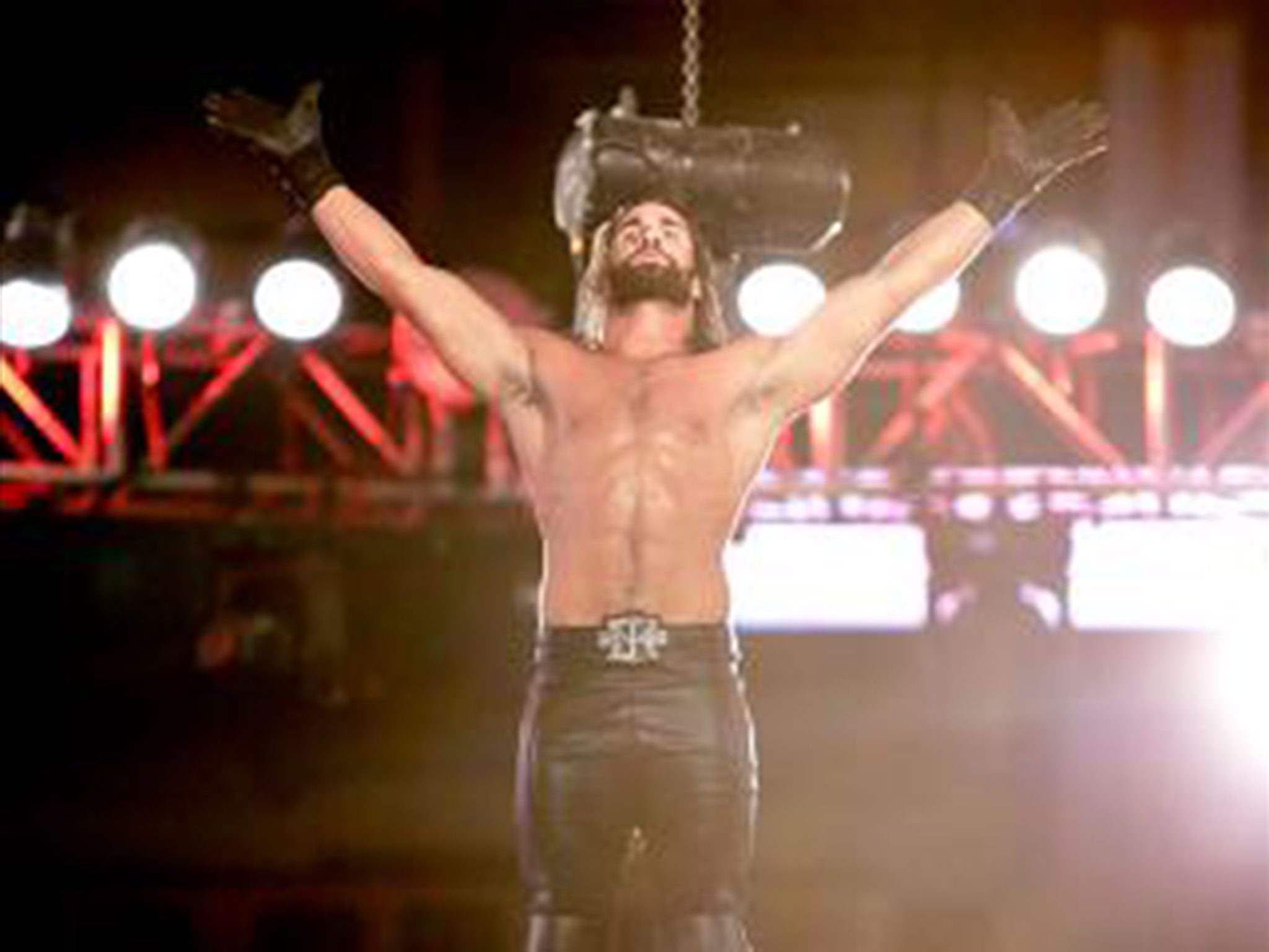 Seth Rollins stands atop the Hell in a Cell