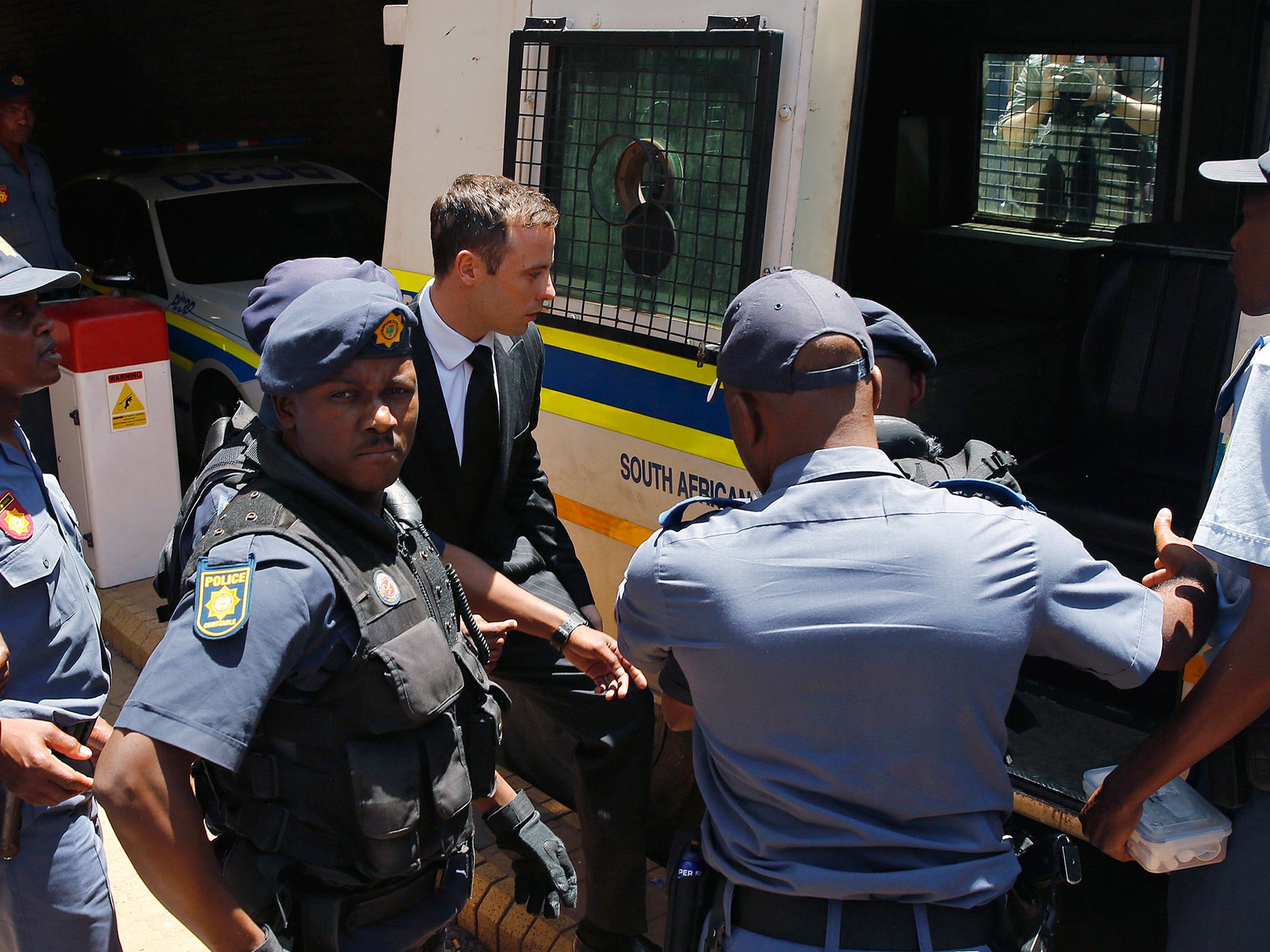 Oscar Pistorius enters a police van after his sentencing at the North Gauteng High Court in Pretoria