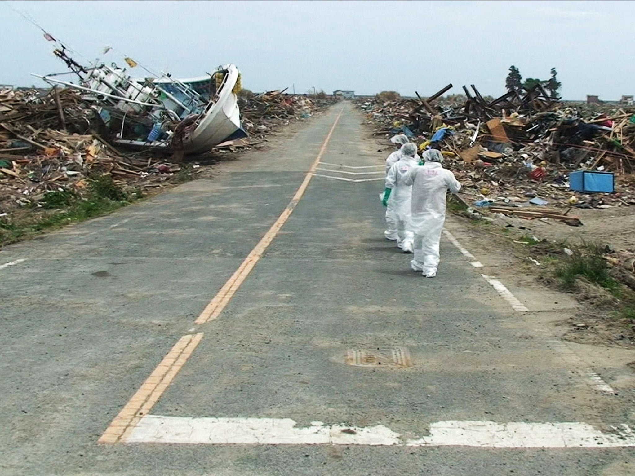 In a scene from ‘Nuclear Nation’, residents of Futaba return to their town for the first time after the nuclear meltdown