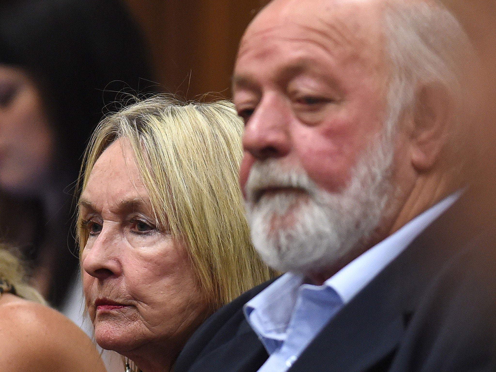 Reeva Steenkamp's parents, Barry Steenkamp and June Steenkamp sit in the Pretoria High Court in South Africa.
