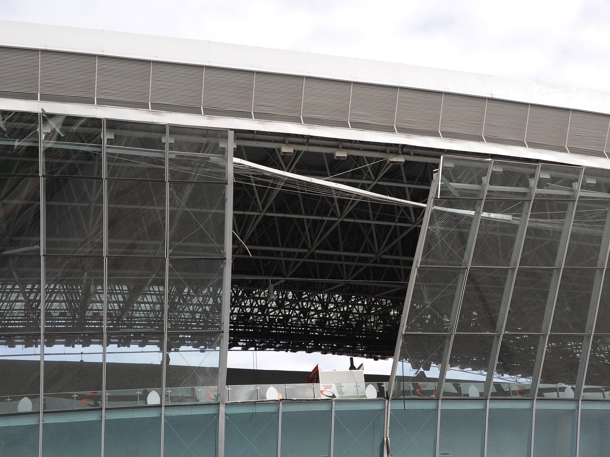 A photo taken on October 20, 2014 shows the Donbas Arena stadium in Donetsk damaged following a nearby explosion.