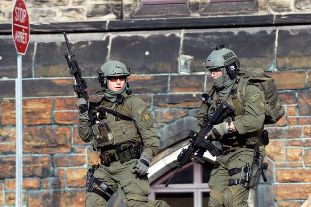 A Royal Canadian Mounted Police intervention team responds to a reported shooting at Parliament building in Ottawa 