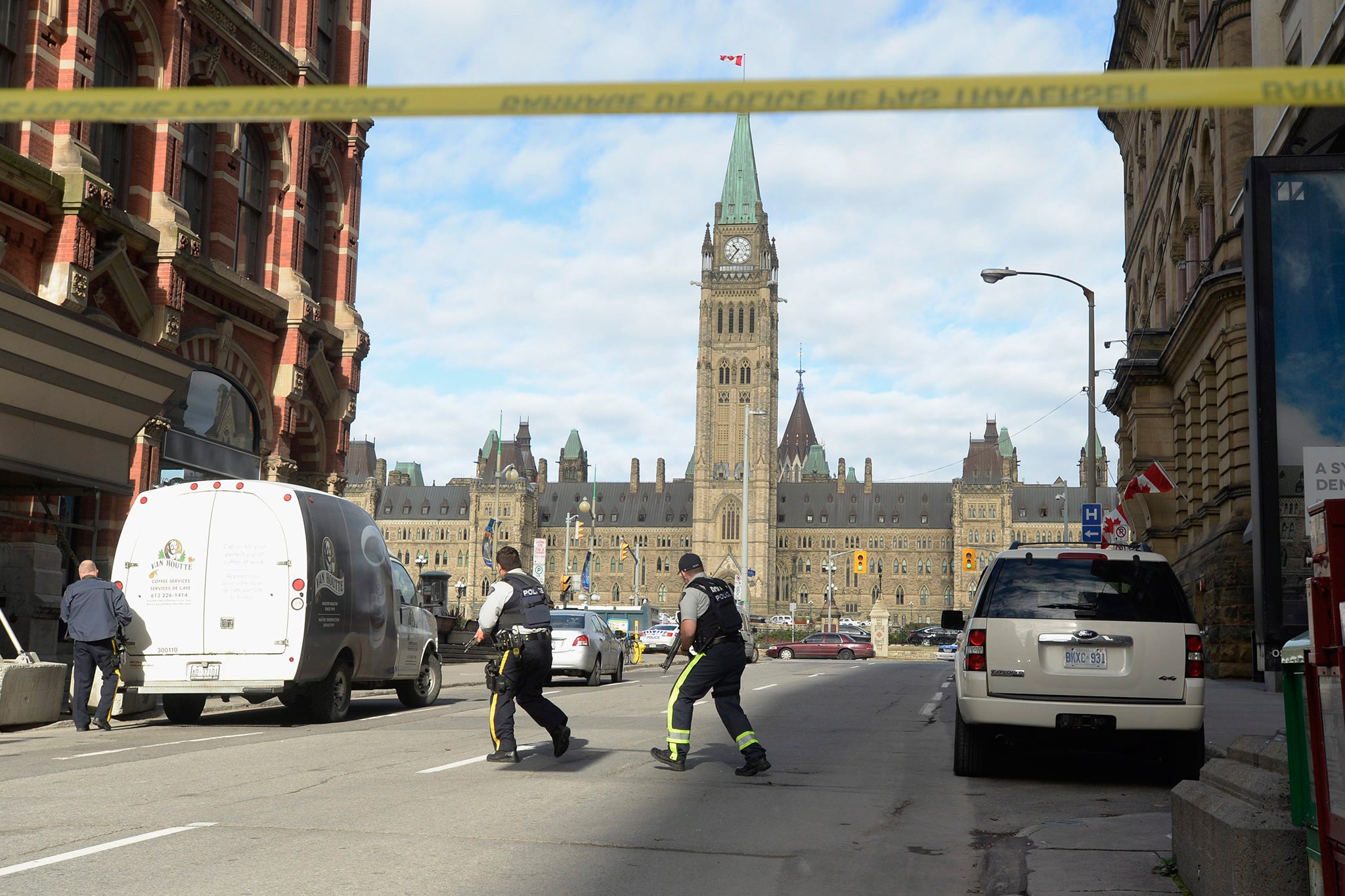 Police secure the scene of a shooting on Parliament Hill in Ottawa