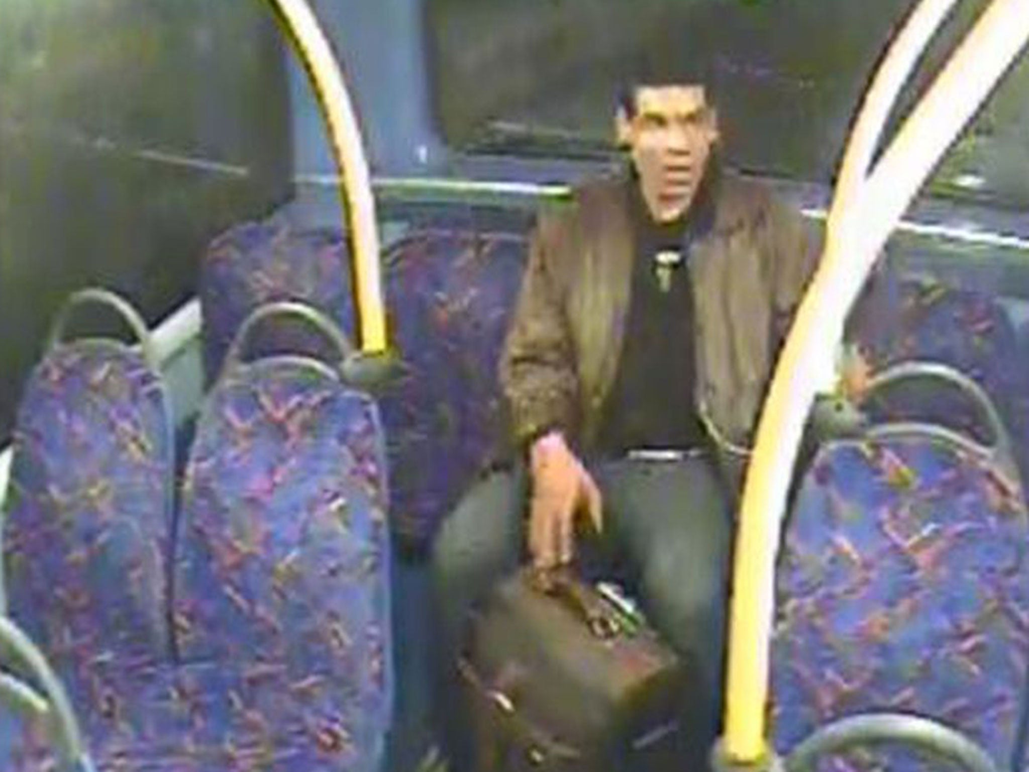 The attacker Philip Spence pictured on a night bus (PA)