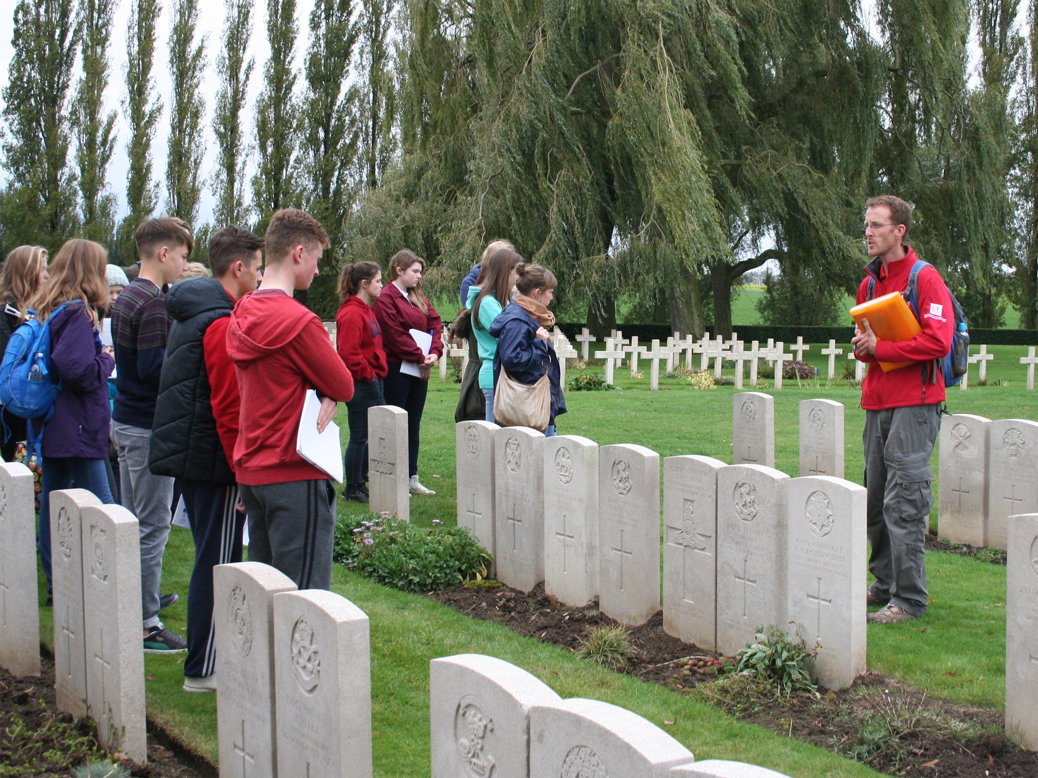 In memoriam: a school group visits Lijssenthoek Cemetery in Belgium, where there are nearly 11,000 war graves