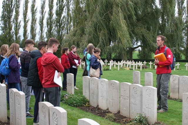In memoriam: a school group visits Lijssenthoek Cemetery in Belgium, where there are nearly 11,000 war graves