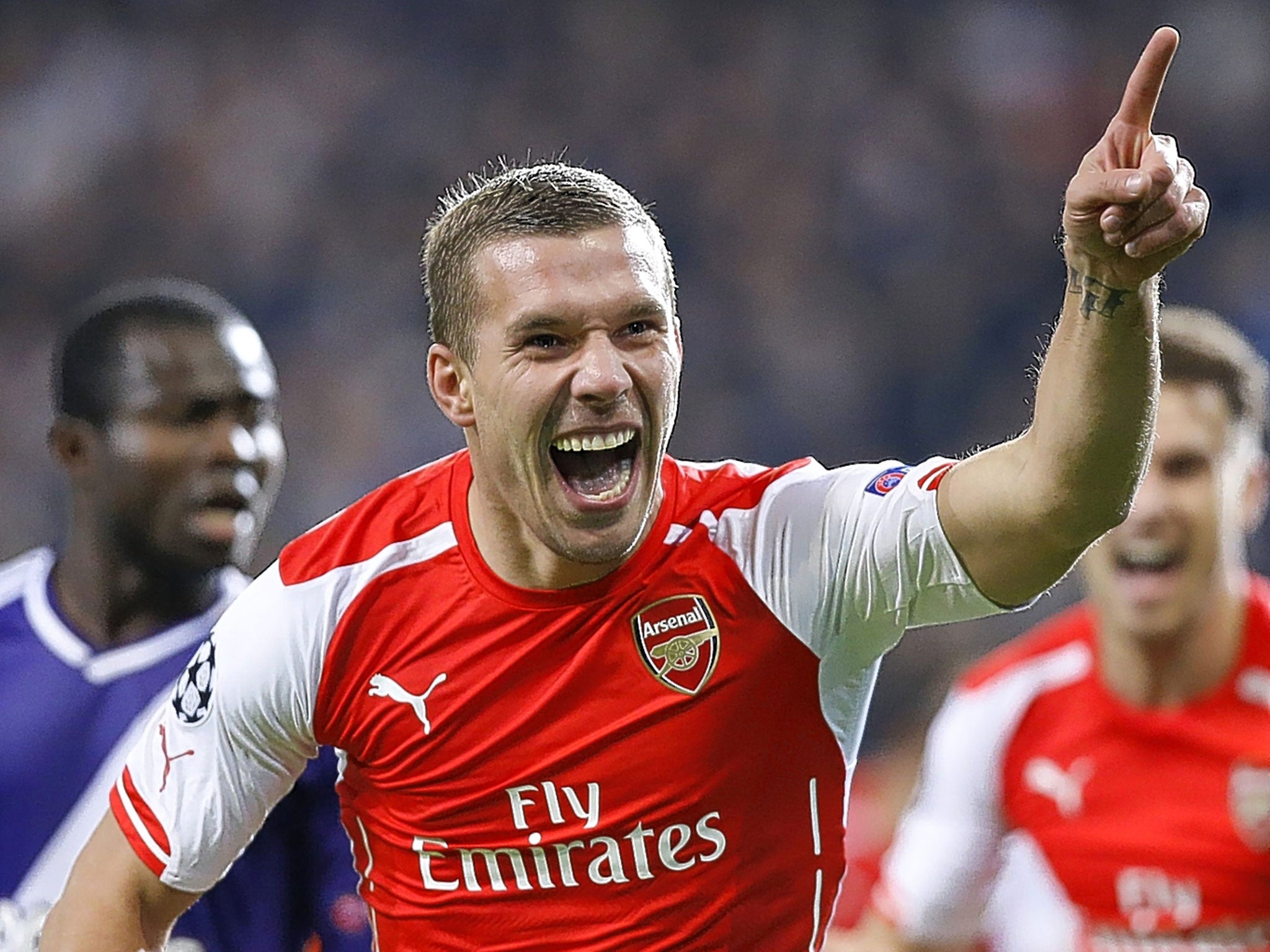 Lukas Podolski celebrates his goal for the Gunners