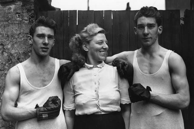 The notorious London gangsters Reggie (left) and Ronnie Kray, pictured here with their mother Violet, were rebuffed when they knocked on the boxing door