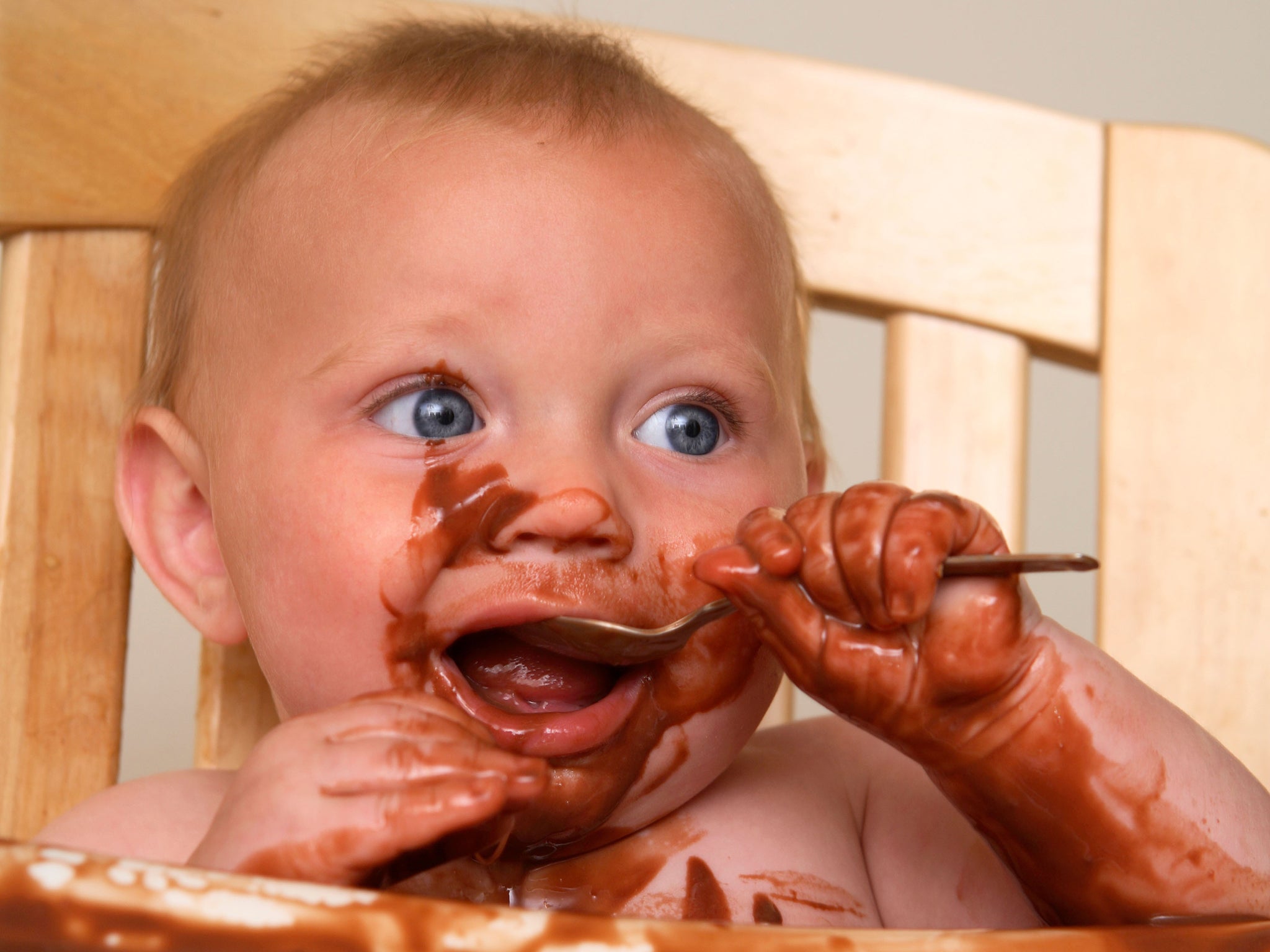 Messy eaters: babies have to learn their table manners
somewhere