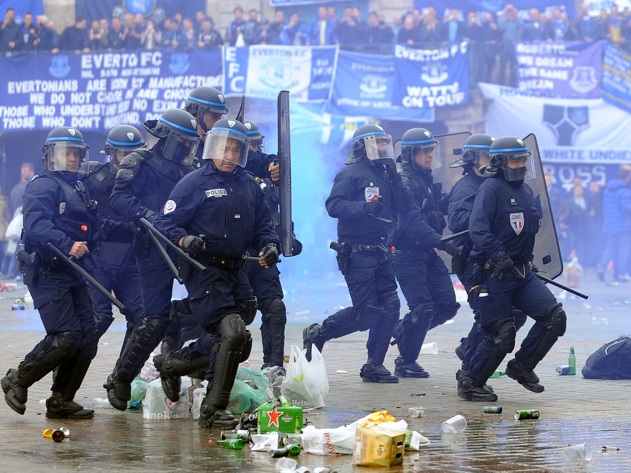 French riot police confront Everton fans in the main square of Lille