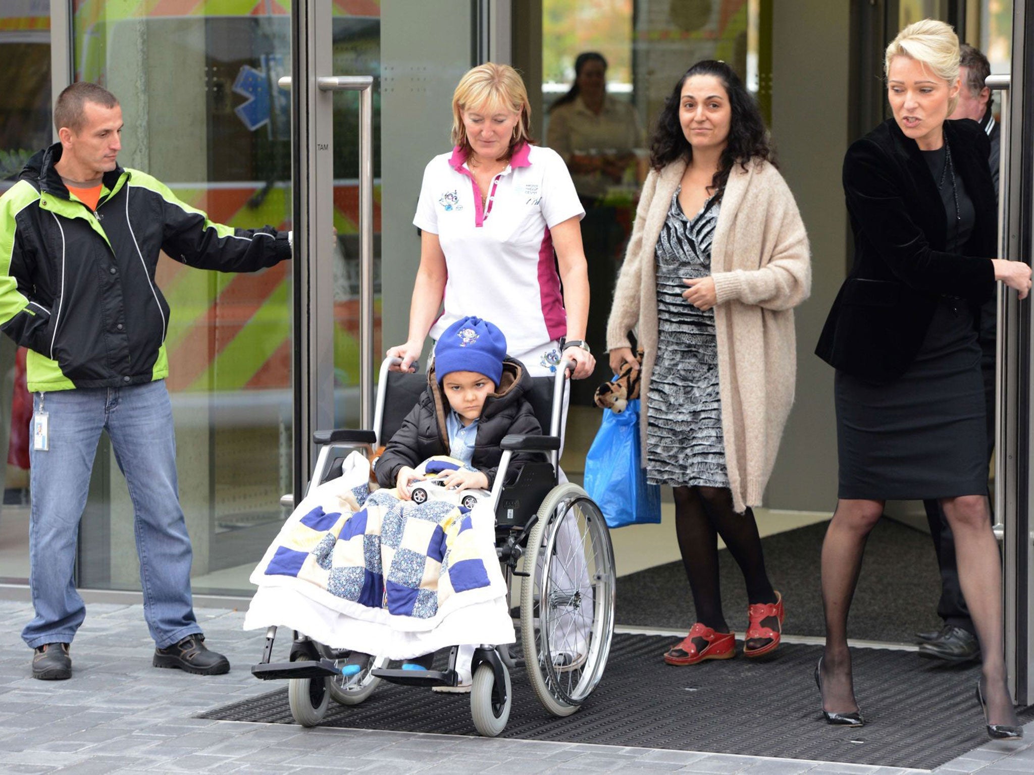 Ashya and his mother leaving Prague hospital after 30 PTC sessions