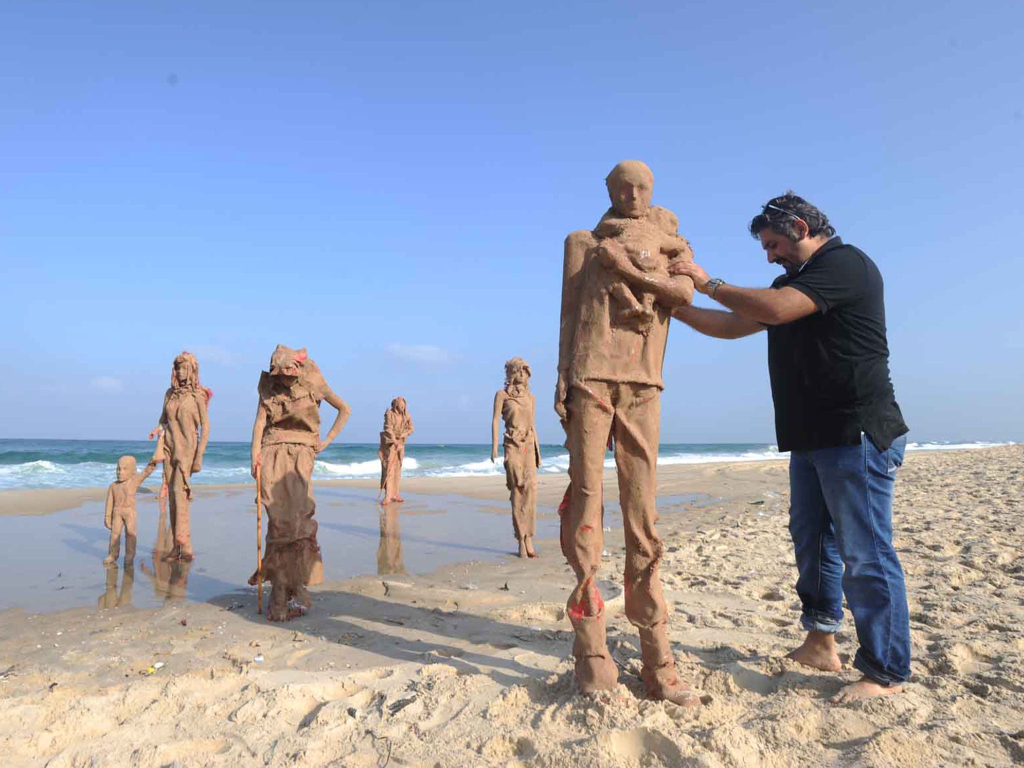 Iyad Sabbah working on his 'Worn Out' installation in Gaza