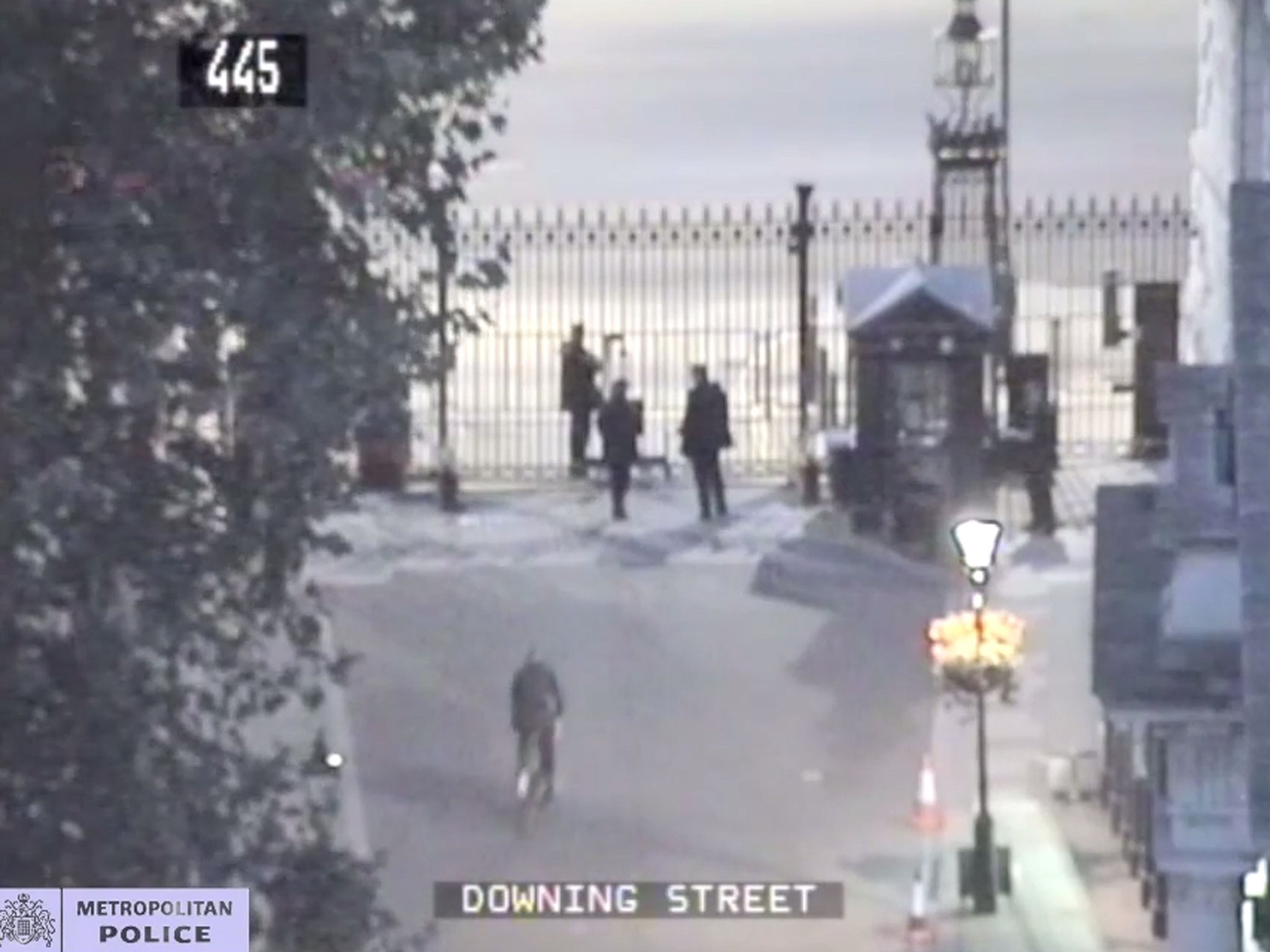 CCTV of Andrew Mitchell (bottom left) approaching officers prior to an exchange with Metropolitan police officers at the gates of Downing Street