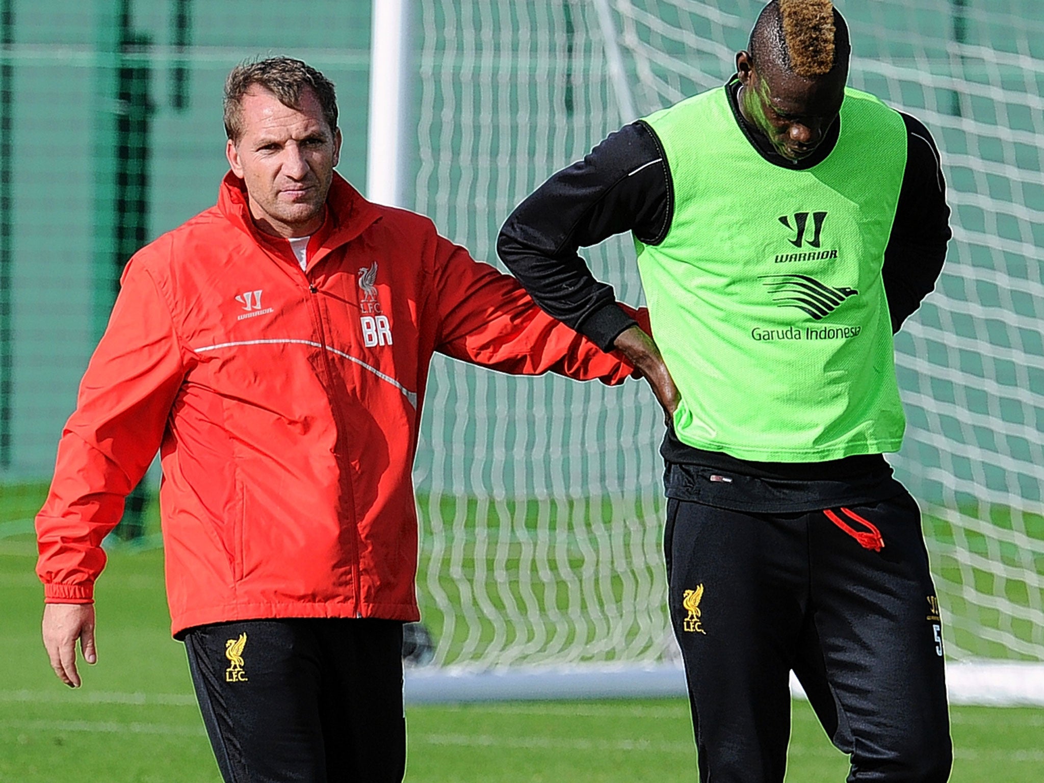 Liverpool manager Brendan Rodgers with Mario Balotelli at Liverpool’s Melwood training ground this week