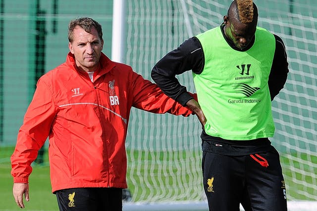Liverpool manager Brendan Rodgers with Mario Balotelli at Liverpool’s Melwood training ground this week