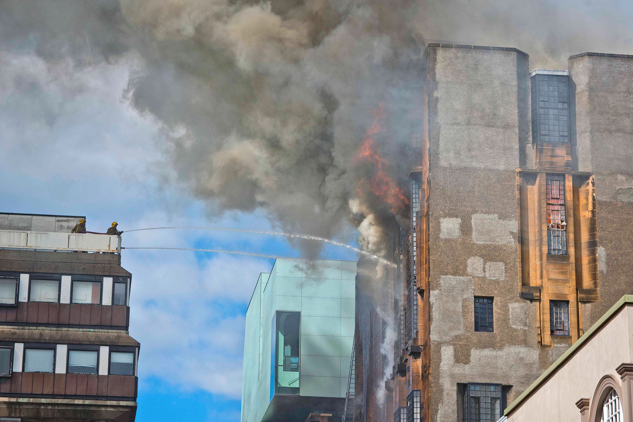 Fire crews tackle the blaze at the Glasgow School of Art's Charles Rennie Mackintosh Building in May