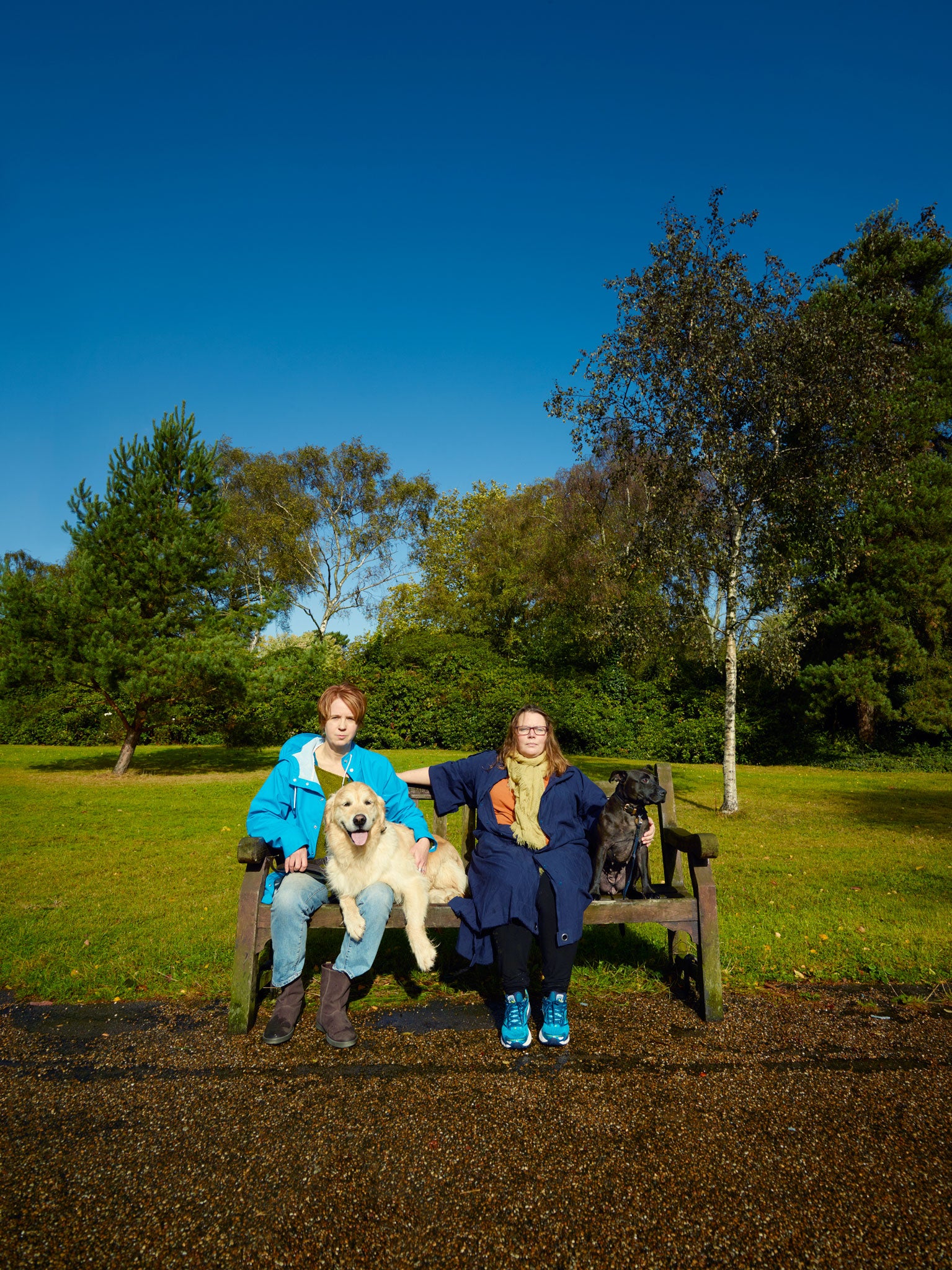 Vicki Pepperdine with her Golden Retriever Archie (left) and Joanna Scanlan with Staffordshire terrier Millie