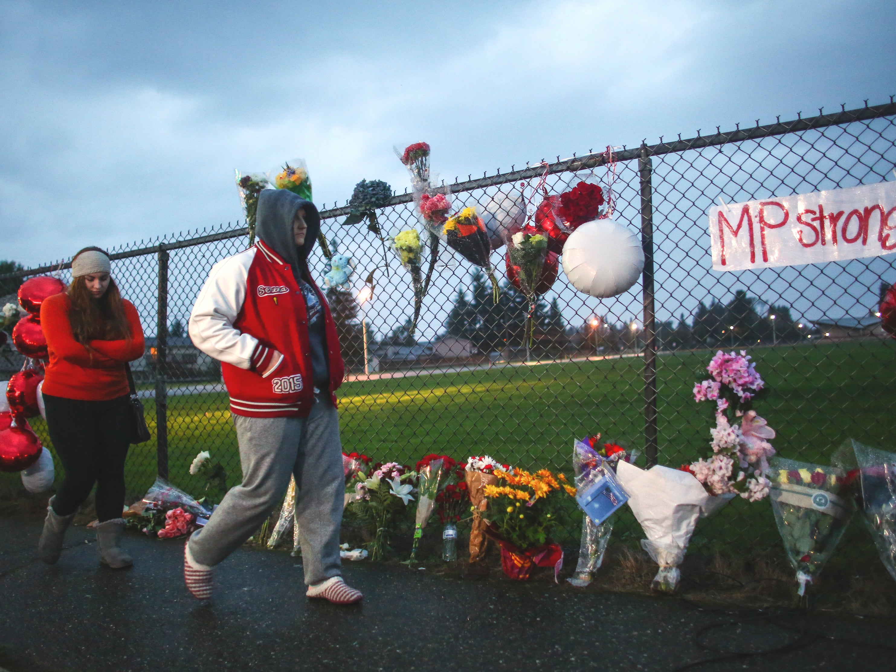 Flowers are placed in memorial outside Marysville-Pilchuck High School after the shooting