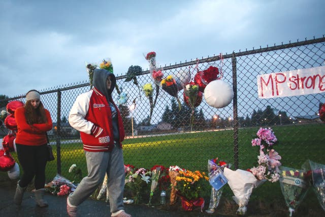Flowers are placed in memorial outside Marysville-Pilchuck High School after the shooting 