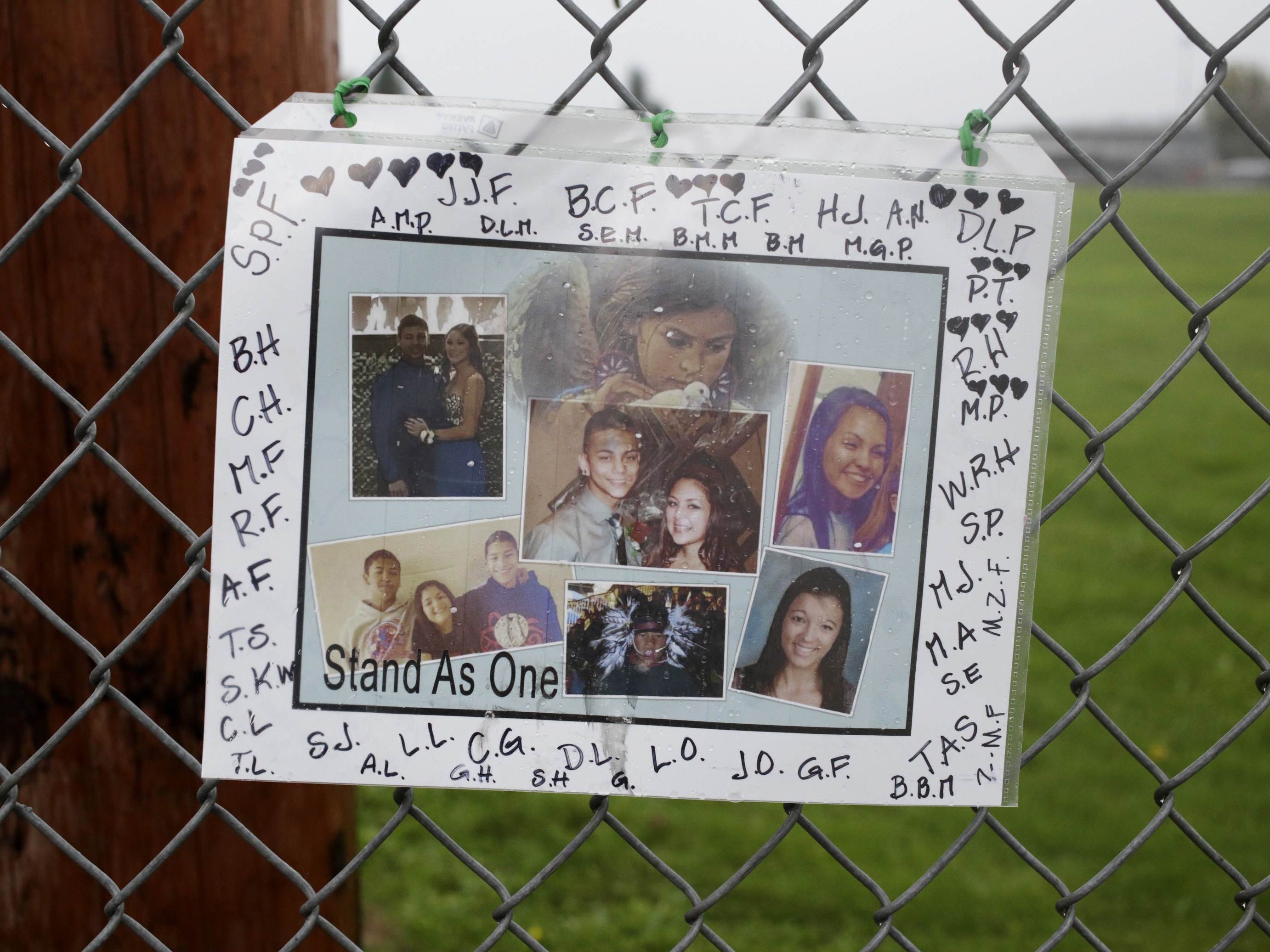 A makeshift memorial is seen outside Marysville-Pilchuck High School the day after a school shooting