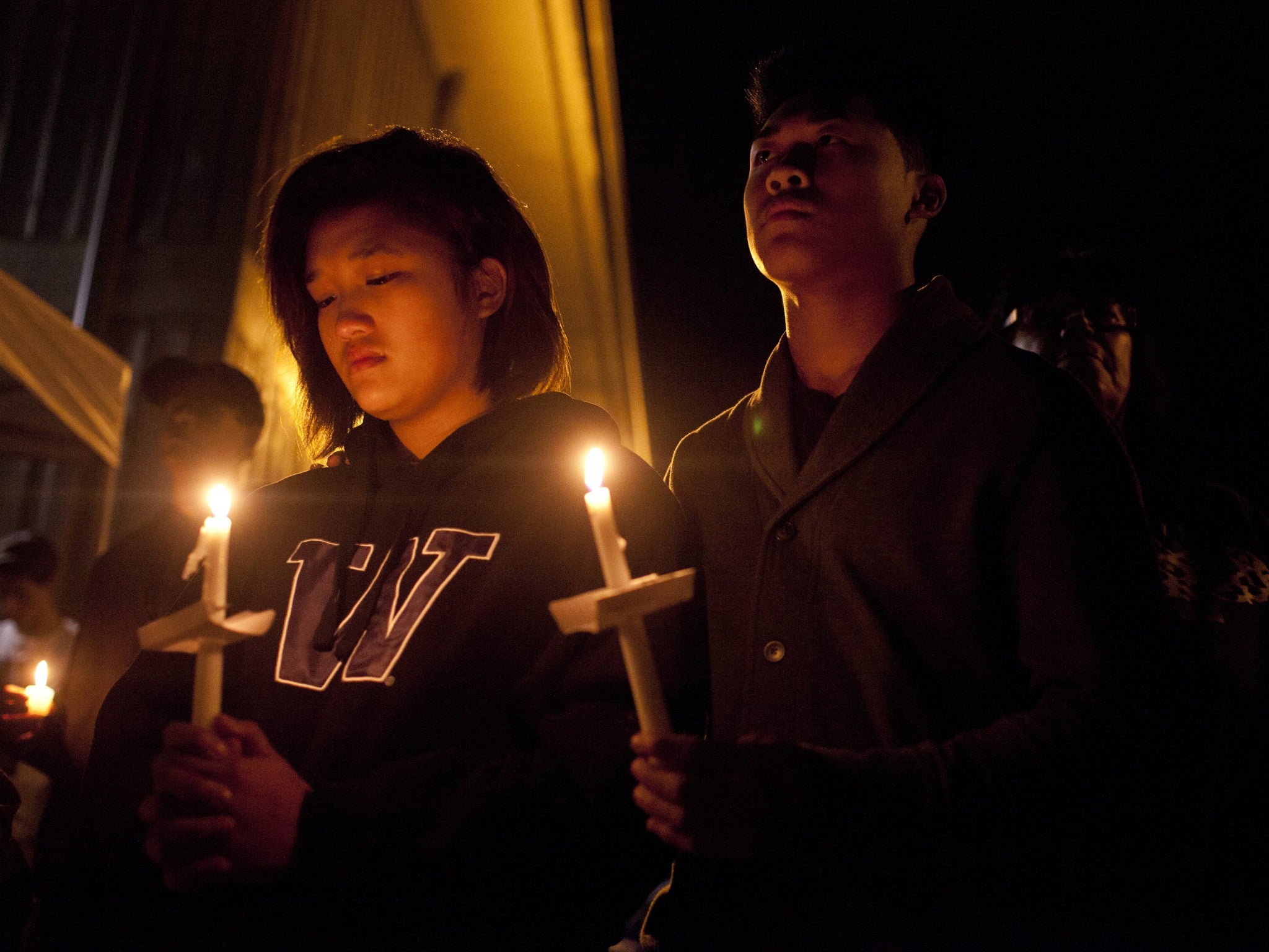 Mourners at a vigil that took place for the victims Marysville-Pilchuck High School after the shooting