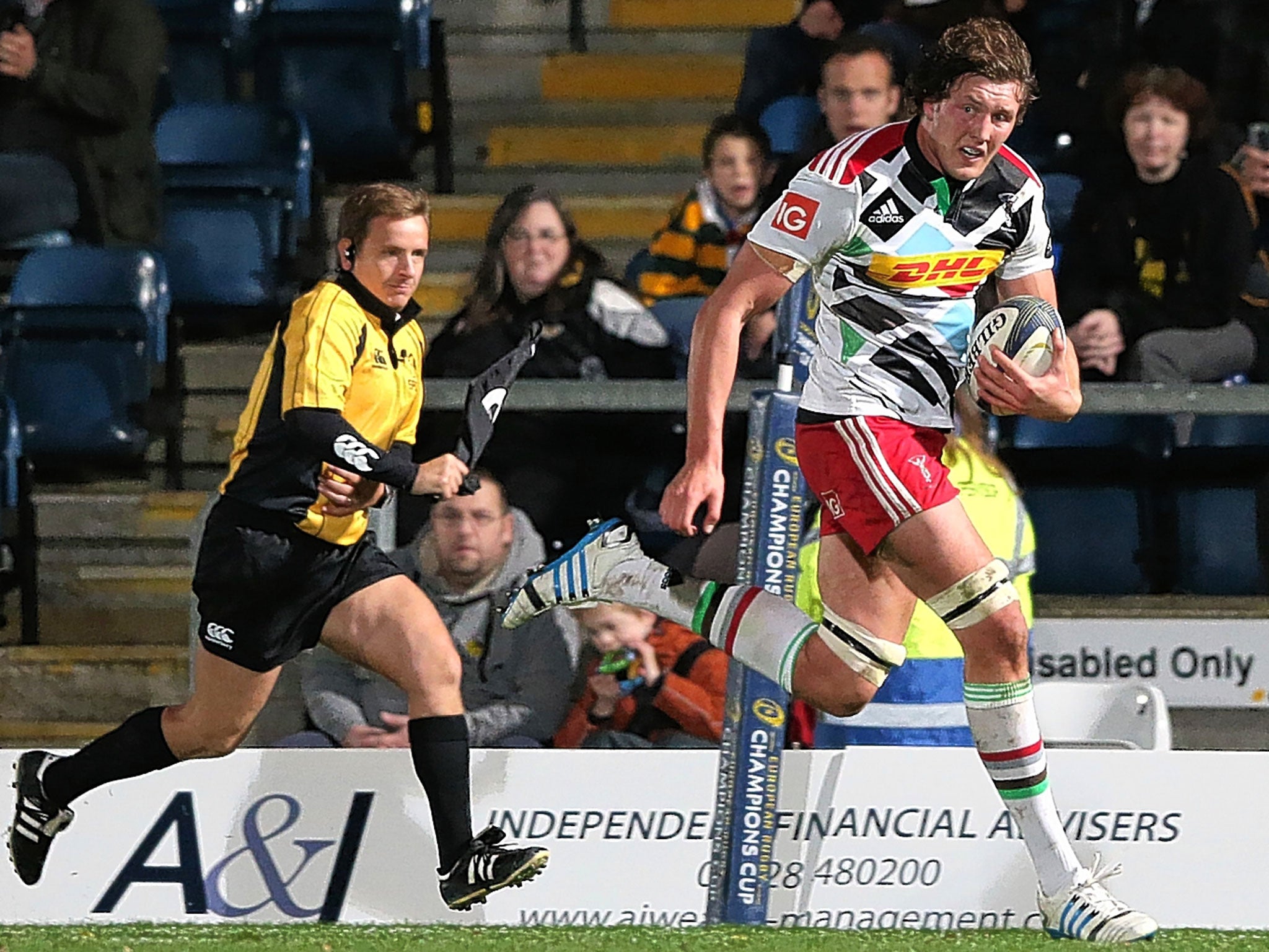 Harlequins’ Charlie Matthews breaks clear to score a try during today's win over Wasps at Adams Park