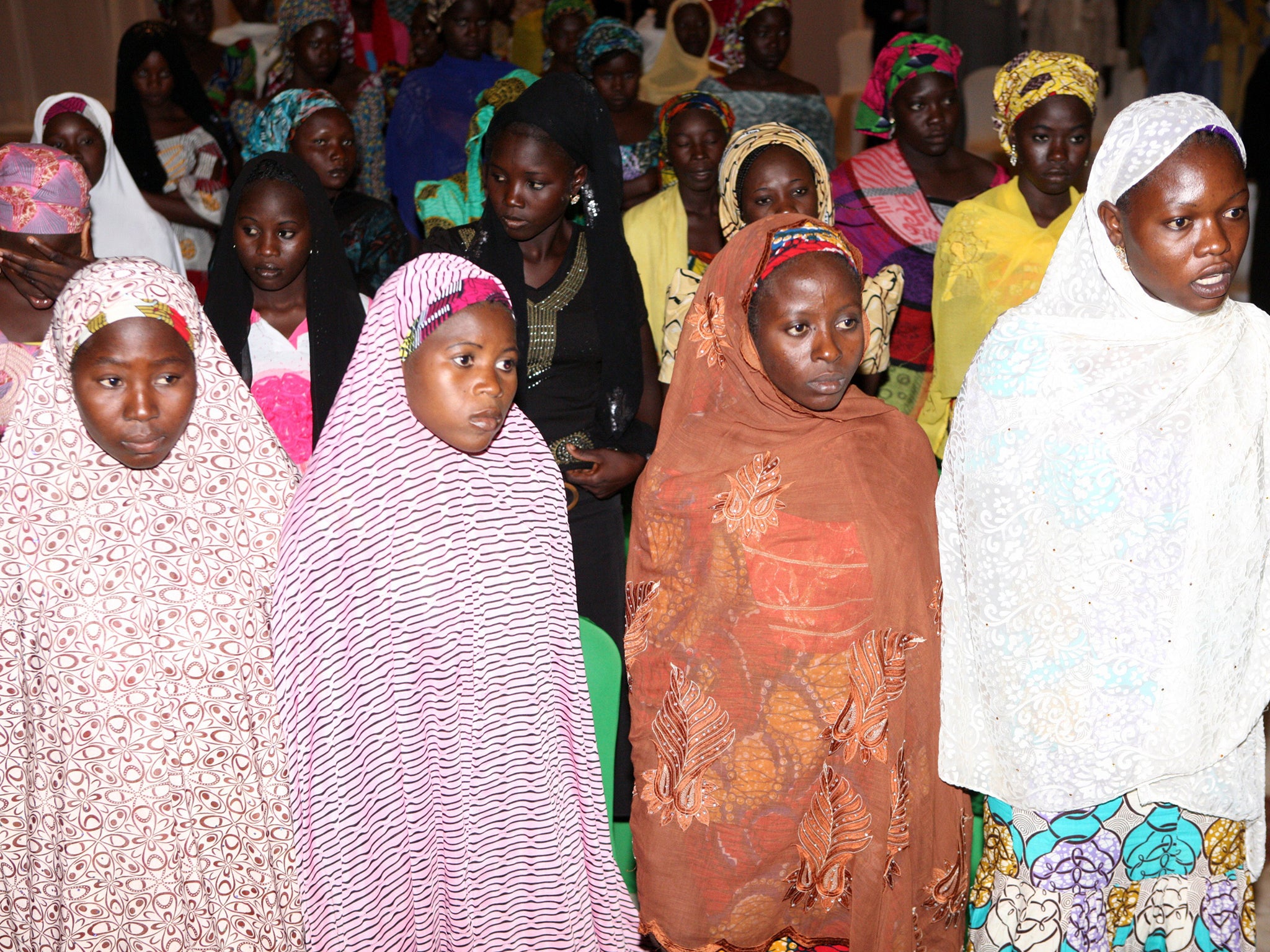 Some of the Chibok schoolgirls who escaped their Boko Haram Islamist captors wait to meet the Nigerian president at the presidency in Abuja on July 22, 2014.