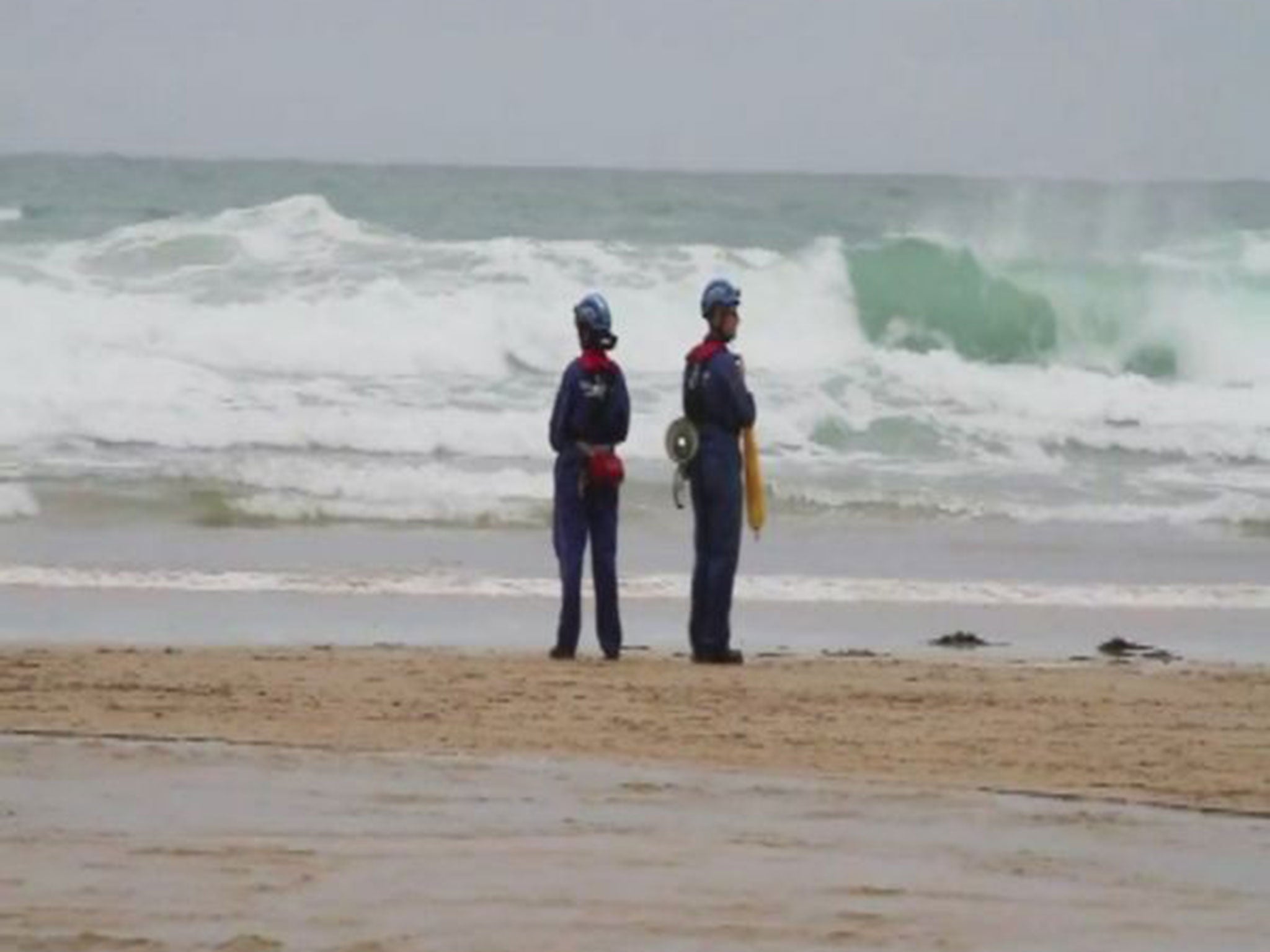 Police and coastguards at Mawgan Porth beach near Newquay, Cornwall