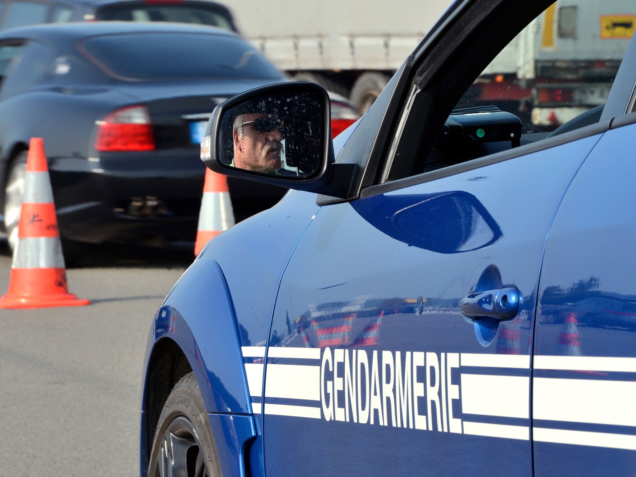 File: A French policeman checks traffic