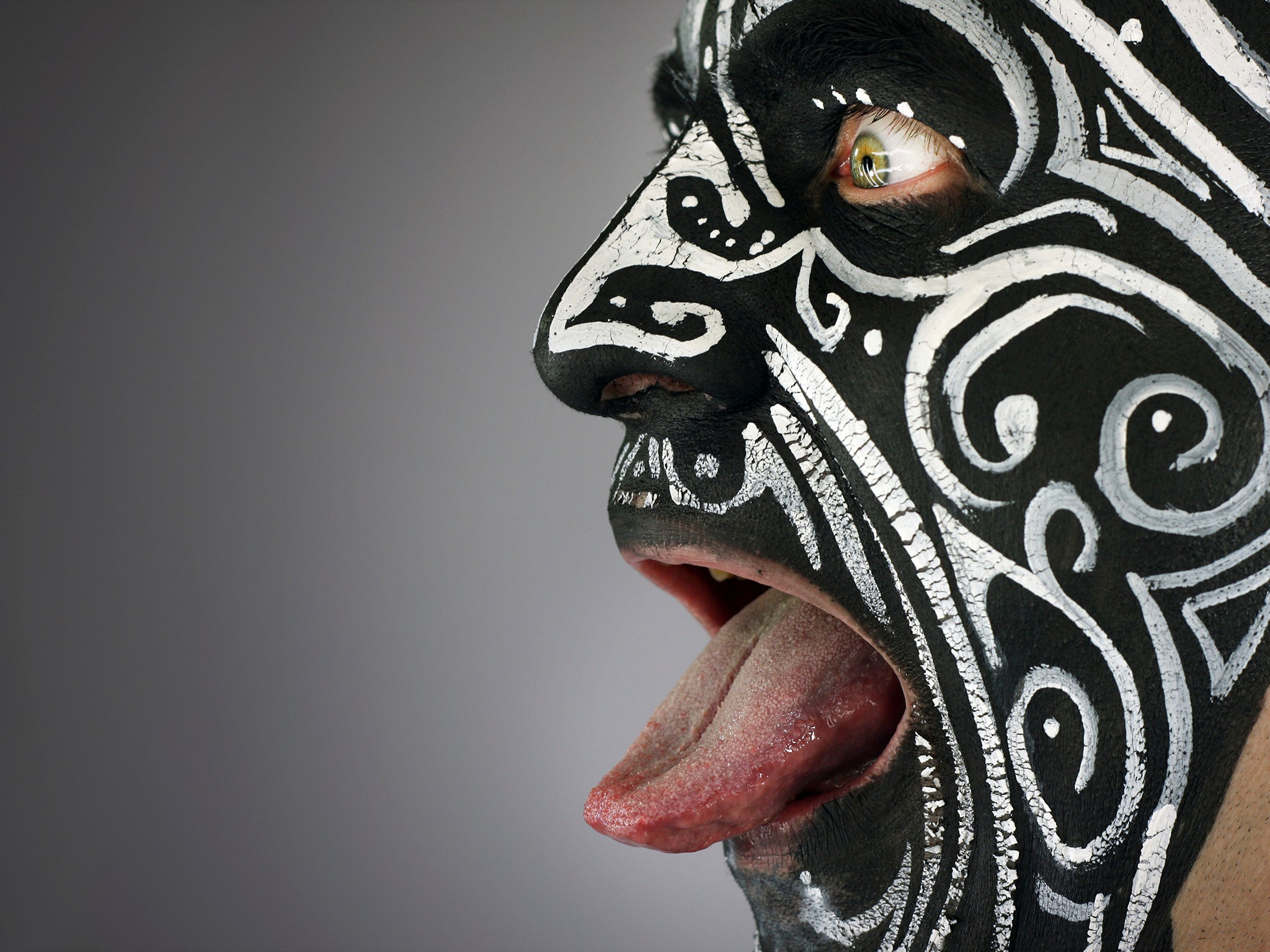 Painted maori tribal warrior face
